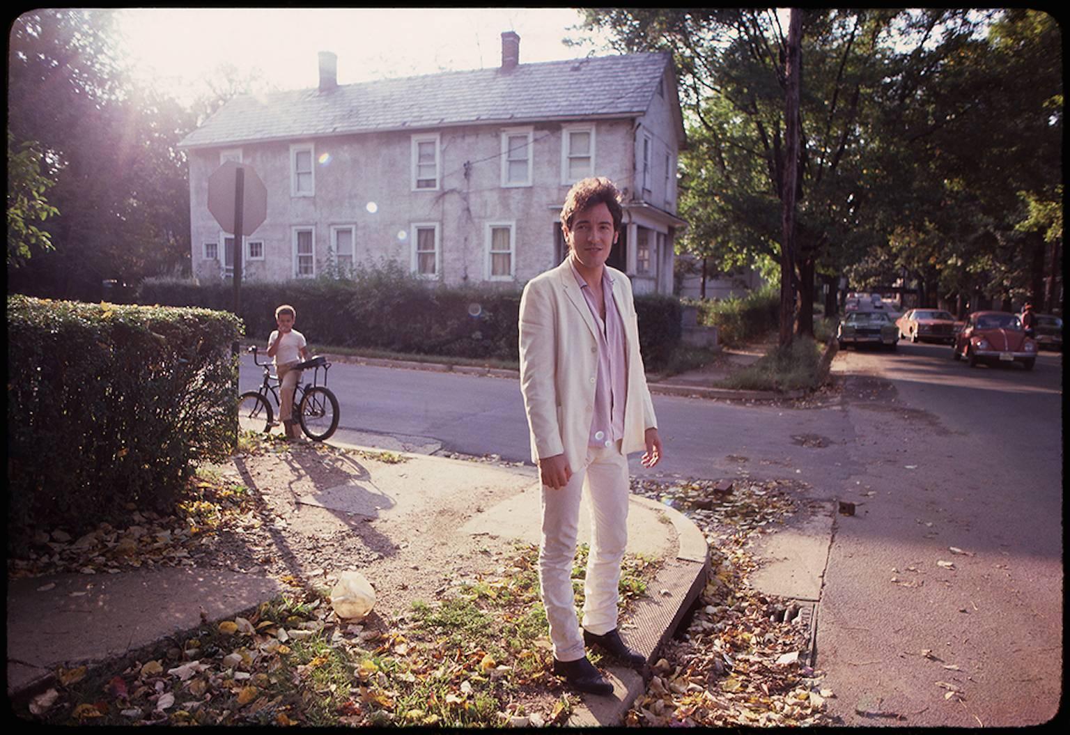 Joel Bernstein Color Photograph - Bruce Springsteen outside his childhood home