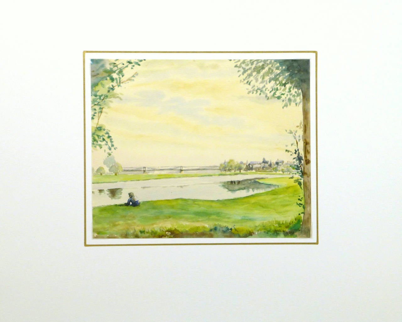 Luminous watercolor depicting a quiet country scene in Normandy, France by C. Groux, circa 1930. The radiant sky, vibrant green pasture, and silver-hued river fill this painting with an otherworldly light, while the kneeling figure in the foreground