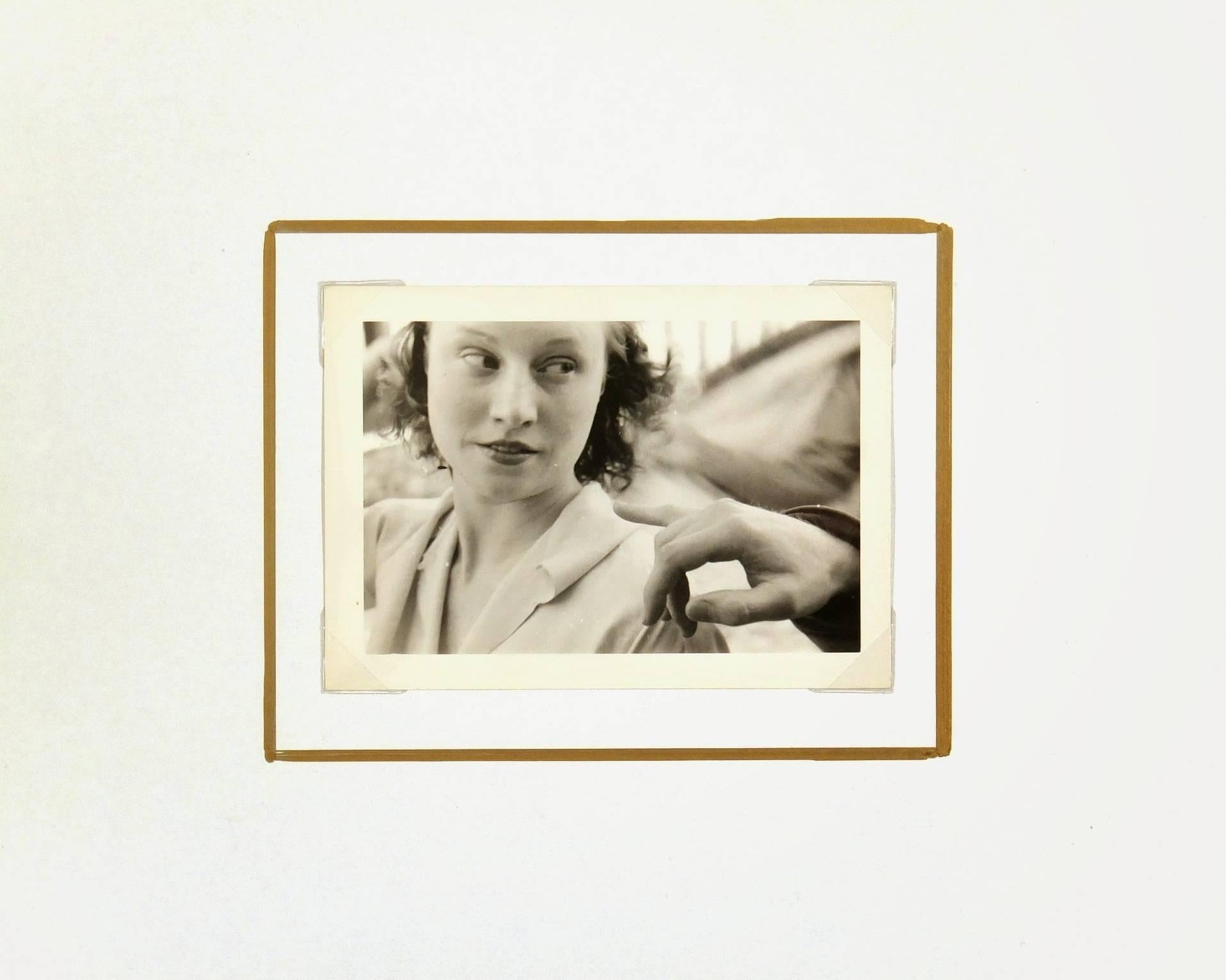 Vernacular black and white photograph of woman. France, circa 1940.

Original artwork on paper displayed on a white mat with a gold border. Mat fits a standard-size frame.  Archival plastic sleeve and Certificate of Authenticity included. Artwork,