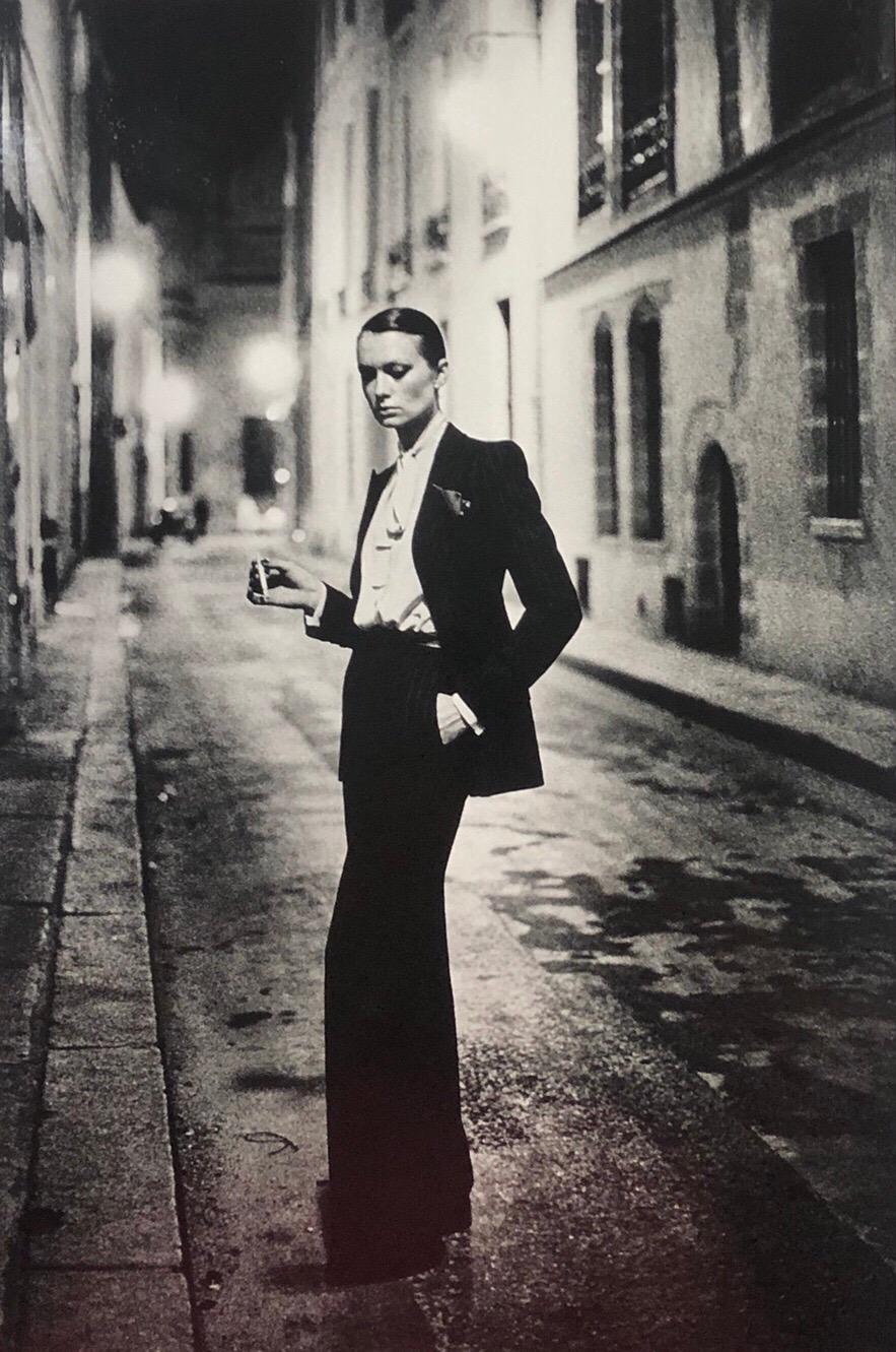 Original early 1980's silver gelatin print title "Rue Aubriot" featuring actress Vibeke Knudsen alone in a lamp lit Parisian street. The image has become one of Helmut Newton's most popular and widely collected.  Styled in a deliberately androgynous