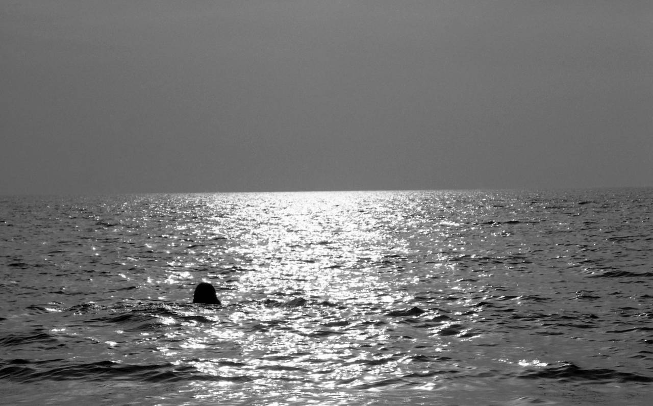 Robin Rice Black and White Photograph - Woman Swimming, Cala Violina