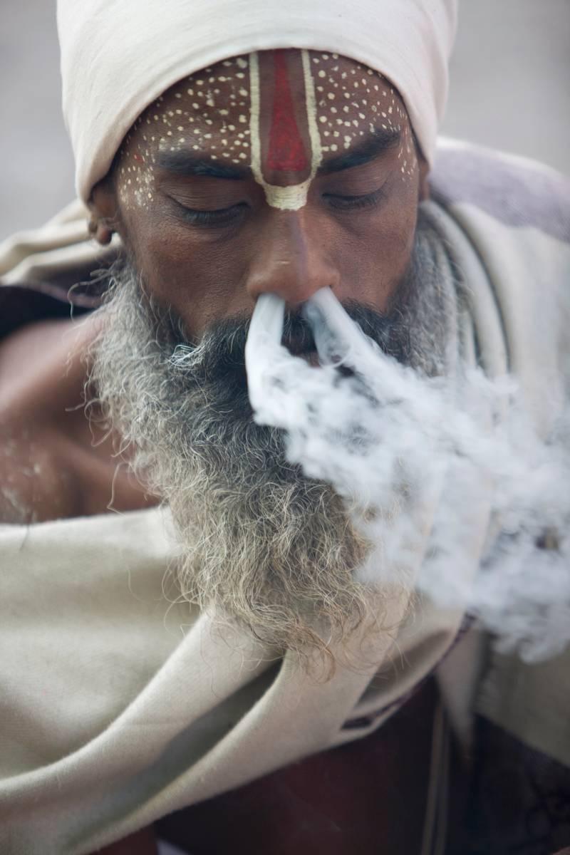 Thomas Kelly Color Photograph - Smoking Sadu, Pashupatinath, Kathmandu, Nepal