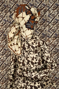 Batin, 2026, Archival pigment print, upholstered frame, 46 1/2 x 34 inches