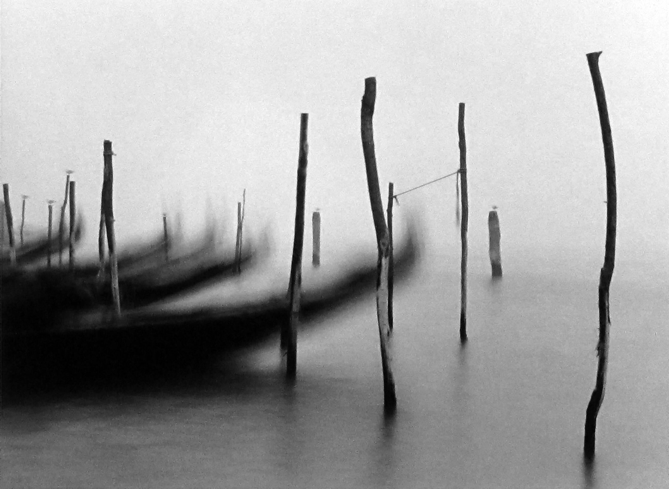 Michael Kenna Black and White Photograph - Gondolas I, Venice, Italy, 1980