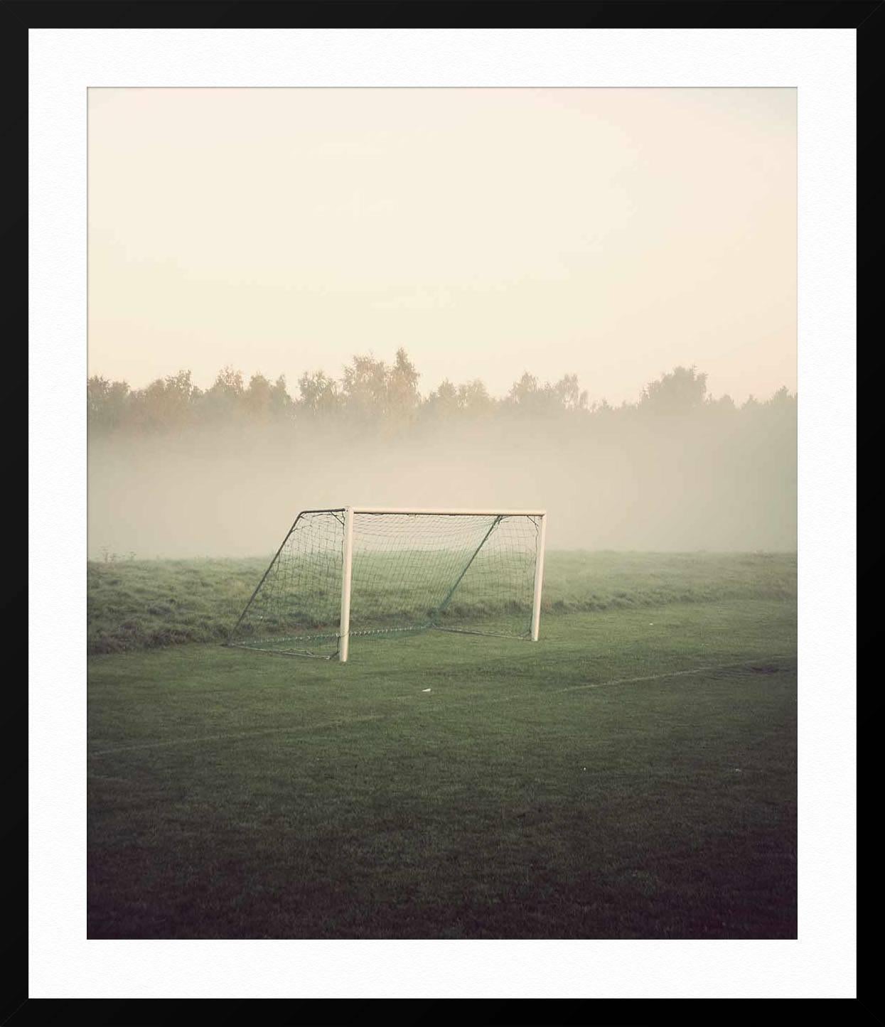 ABOUT THIS PIECE: Photographer Kim Høltermand took this photo in the early morning at a Danish Soccer Pitch. He is known for his moody, quiet photos that show public spaces before the crowds. They offer a sense of calm.

ABOUT THIS ARTIST: Kim