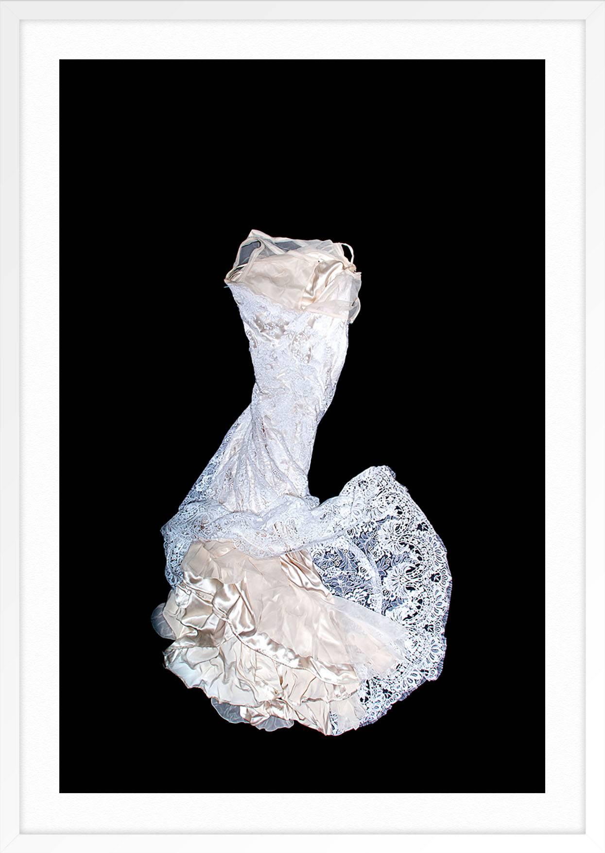 ABOUT THE PIECE: Photographer J. M. Giordano collaborated with gown designer Jill Andrews to shoot bridal gowns which were returned for repair after the wedding night. The series looks at the gowns as artifacts and metaphors for the bride's second