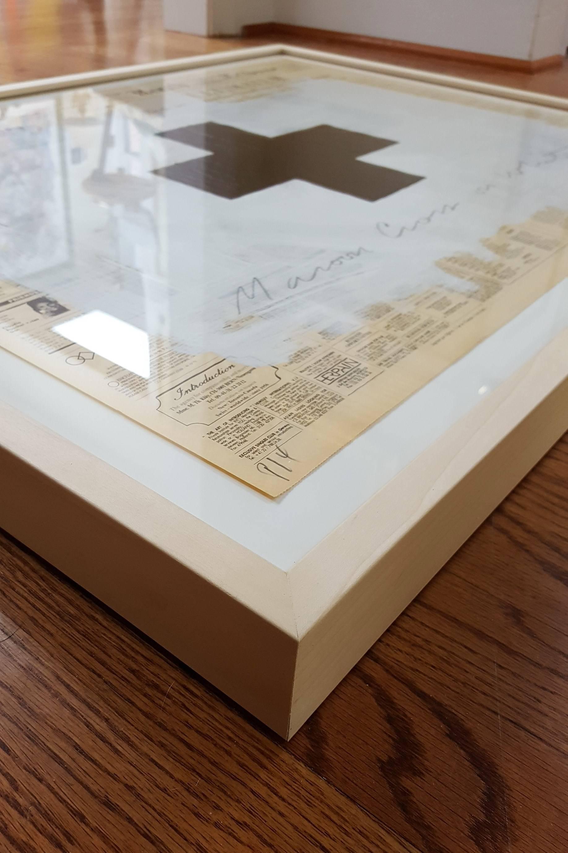 An original signed oil over acrylic paint on Herald Tribune newspaper by American artist Robert Longo (1953-) titled "Maroon Cross on White", 1991. Hand pencil signed and dated by Longo lower right. Hand pencil titled by Longo across the