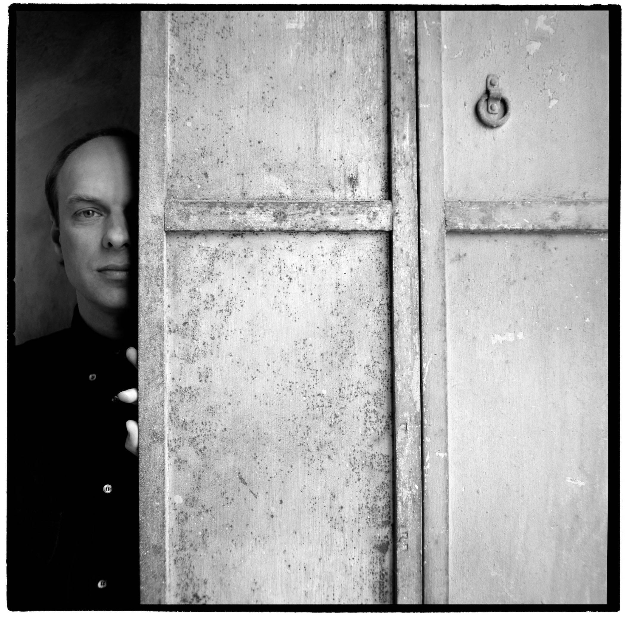 Karen Kuehn Black and White Photograph - Brian Eno • 1989 • NYC • Interview Magazine