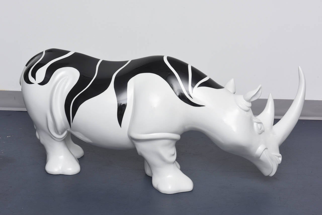 Rhinozebros - Rhinoceros adorned with a zebra skin - Resin Sculpture - Black Figurative Sculpture by Patrick Schumacher