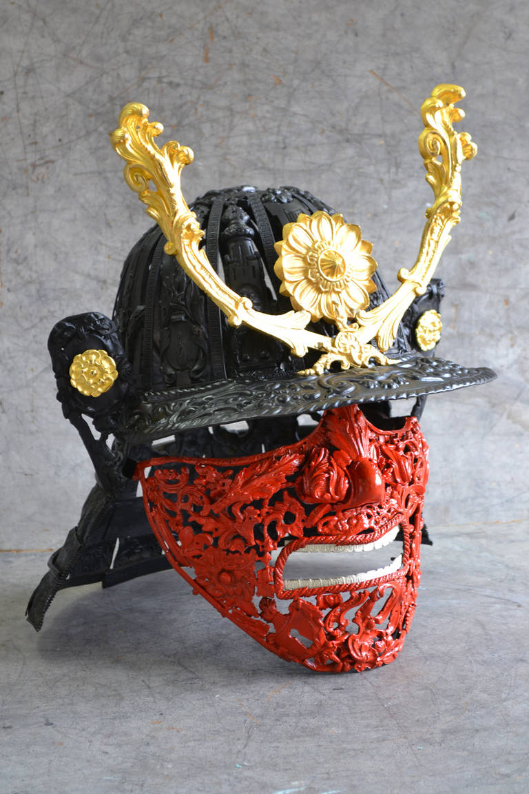 Bellino’s Baroque Samurai is a unique contemporary bronze sculpture representing a red samurai face with his black and gold helmet made of antique bronze ornaments that are welded together in a meticulous fashion. With heavy “Renaissance” innuendos,