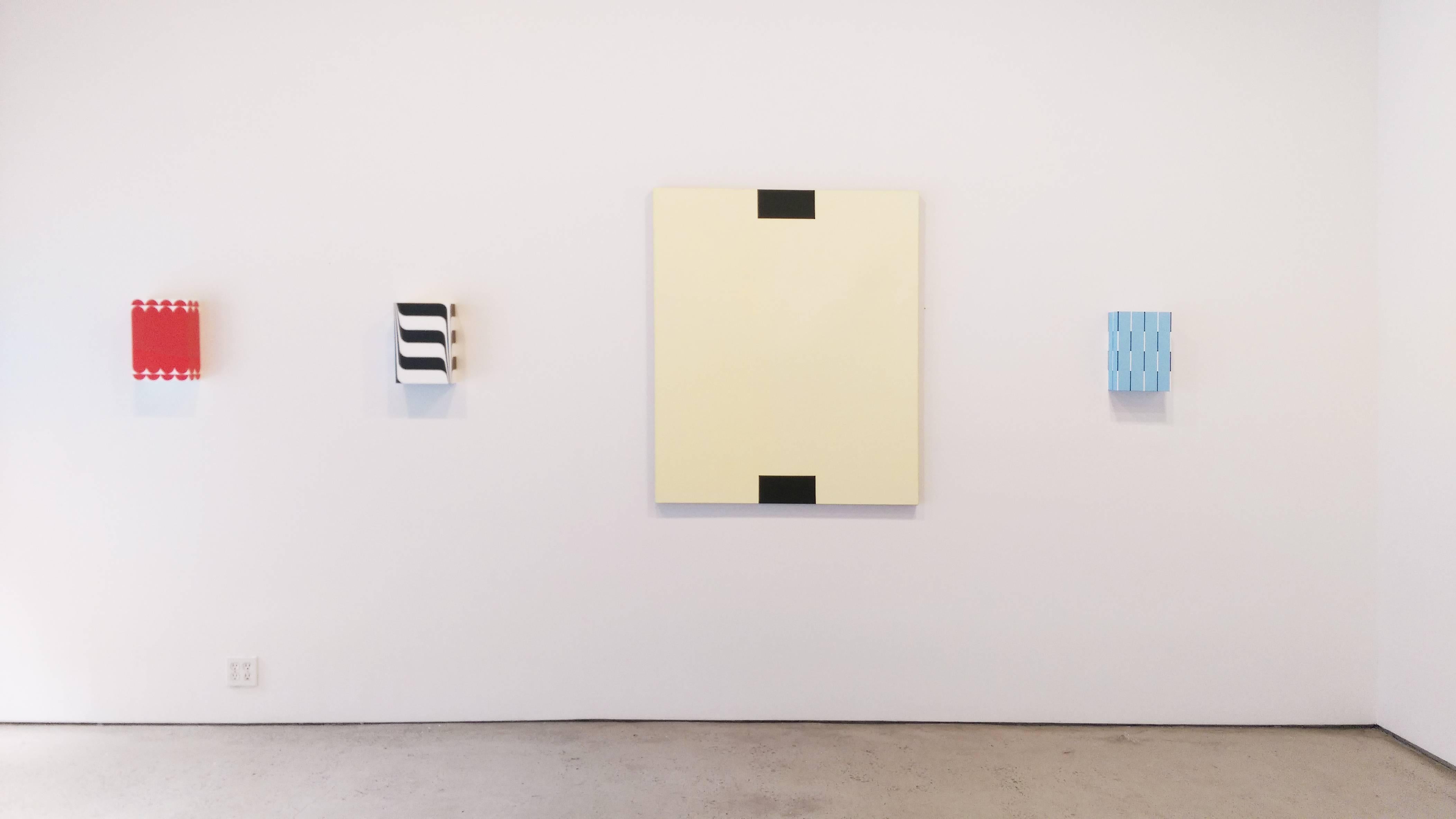 Mambo Italiano is primarily light blue with thin stripes of white and black.

Richard Roth’s small box-like paintings are beautifully crafted and executed with delicate and sharp precision. His vaguely familiar patterns and compositions embody