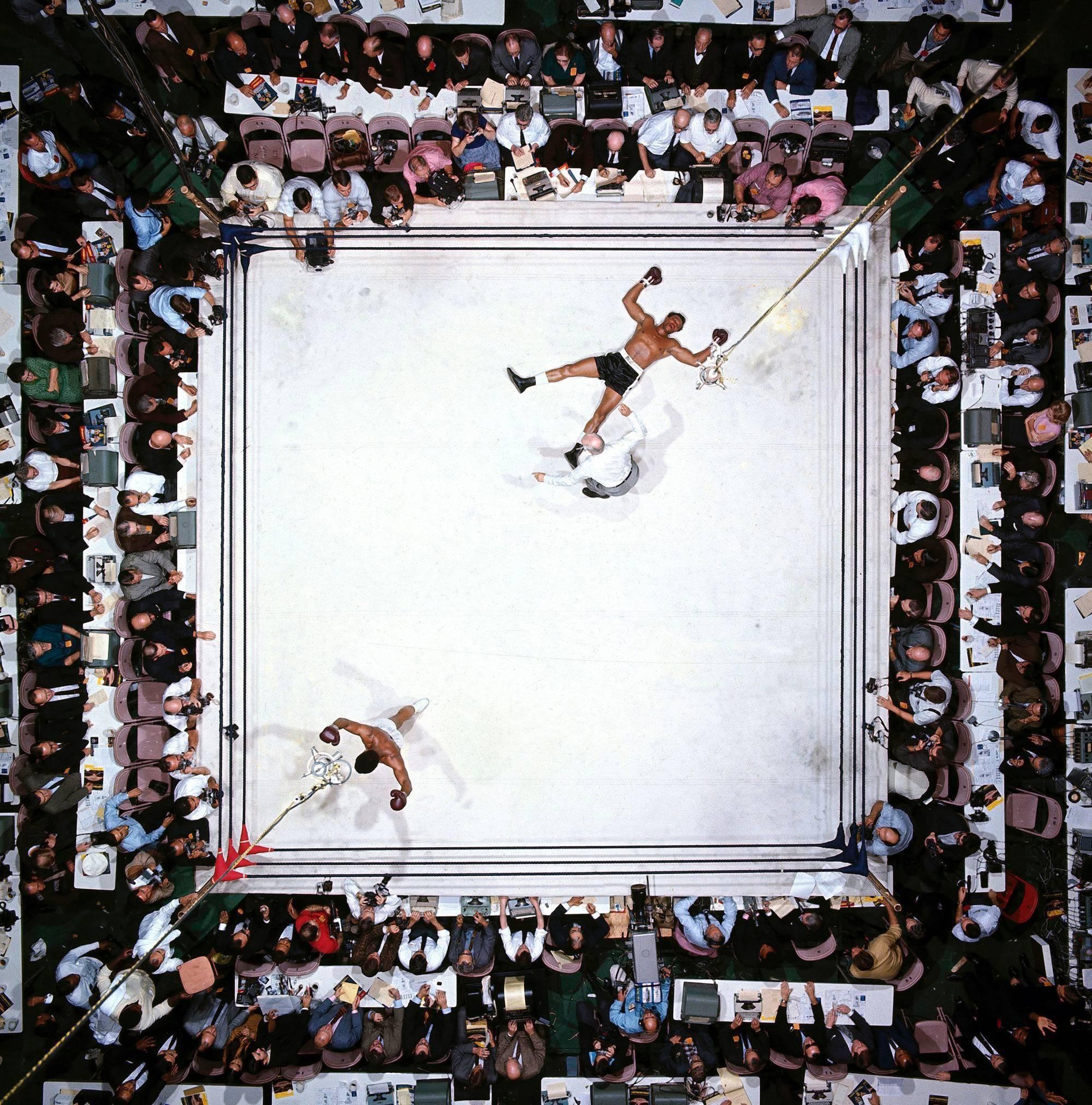 Neil Leifer Color Photograph - Aerial view of Muhammad Ali victorious after round 3 knockout