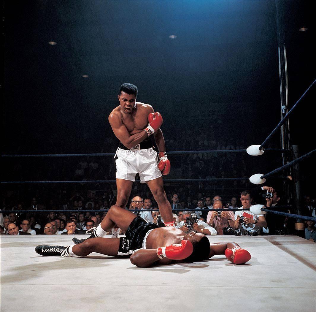 Neil Leifer Color Photograph - Muhammad Ali standing over a fallen Sonny Liston