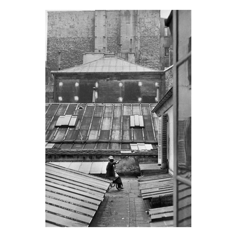 Henri Cartier-Bresson Black and White Photograph - Paris, France (Boy w/ gun on tricycle)