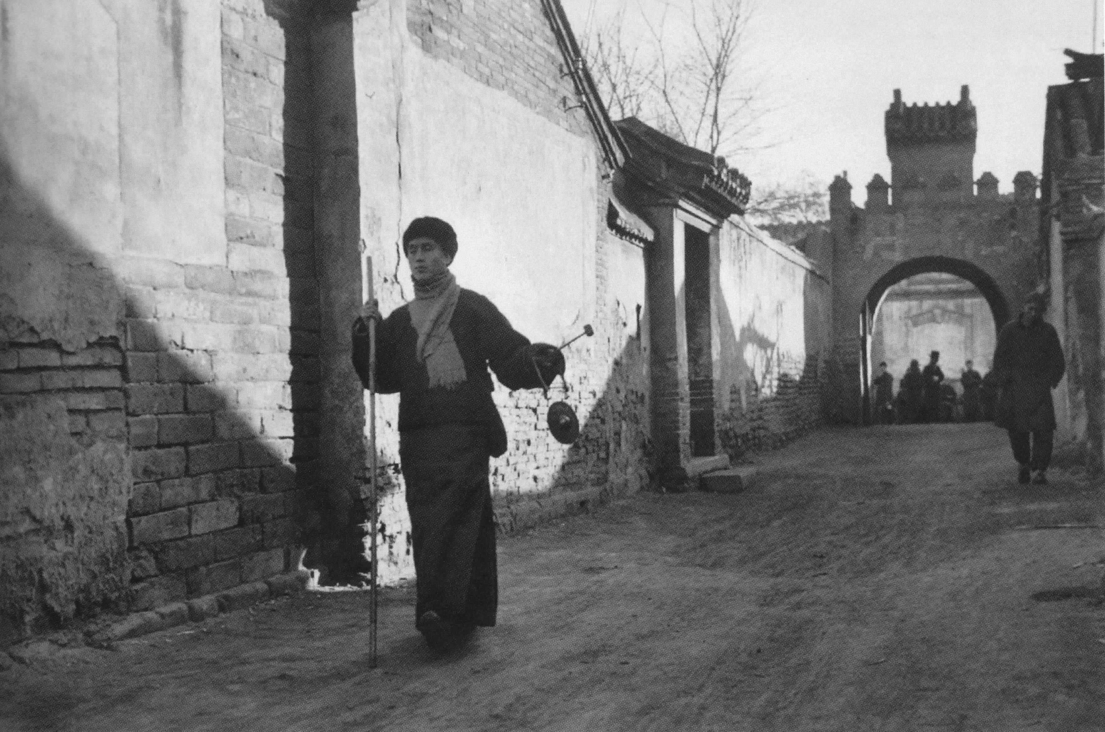 Henri Cartier-Bresson Black and White Photograph - Peking, China, (Man holding walking stick)