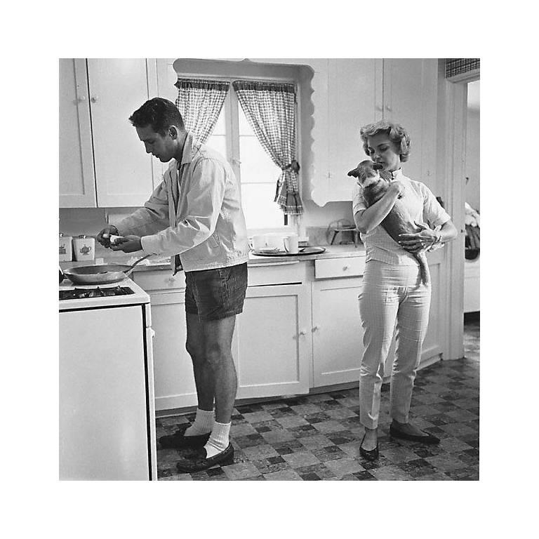 Sid Avery Black and White Photograph - Paul Newman and Joanne Woodward in the Kitchen of their Beverly Hills Home