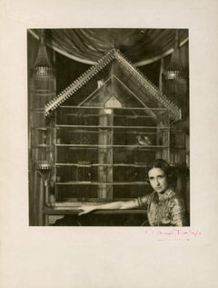 Portrait of Lise Deharme Lise Deharme, chez elle devant sa cage a oiseaux