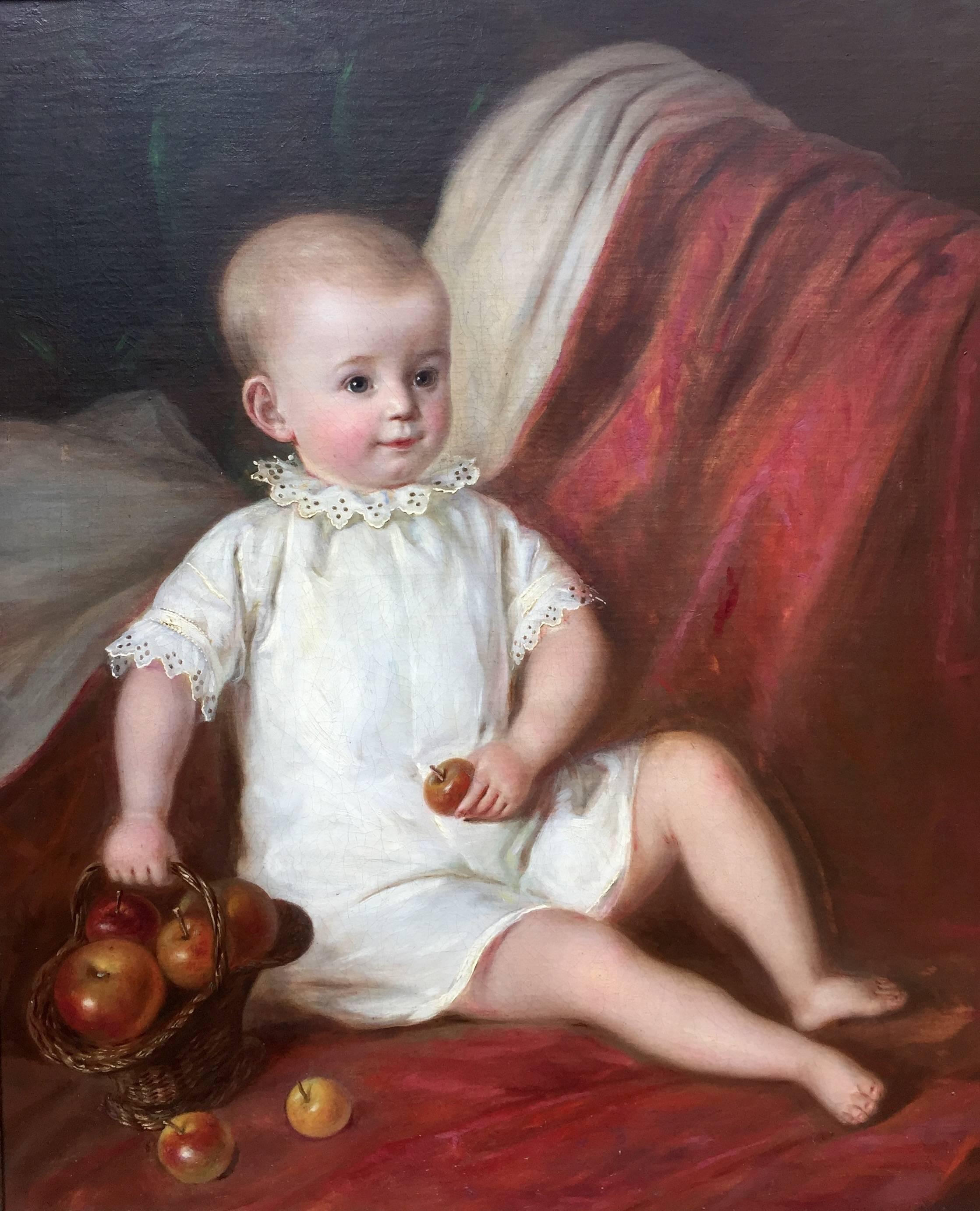 baby holding an apple