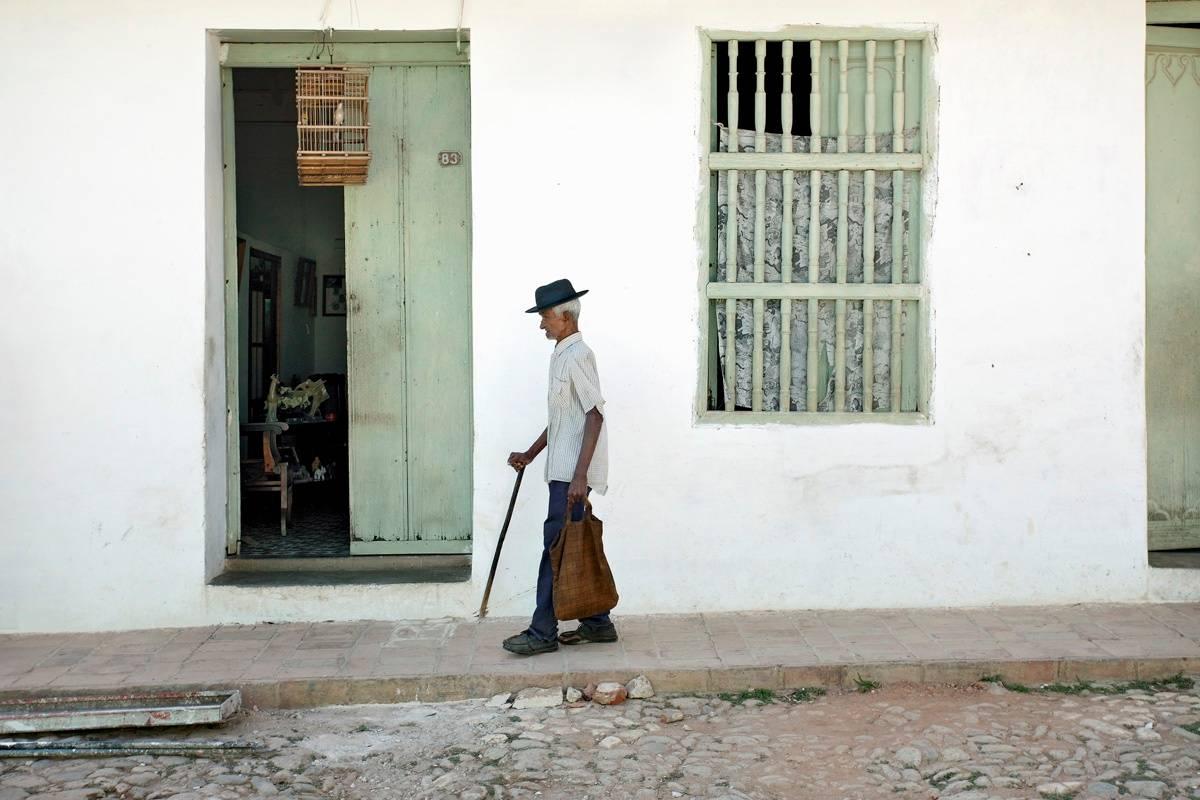 Man with Cane, Trinidad, Cuba - Photograph by Jeffrey Milstein