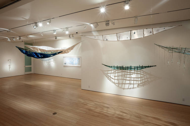 A hauntingly beautiful boat sculpture made of steel, silk, antique pages, plaster and graphite.  This sculpture is suspended from the ceiling using monofilament.