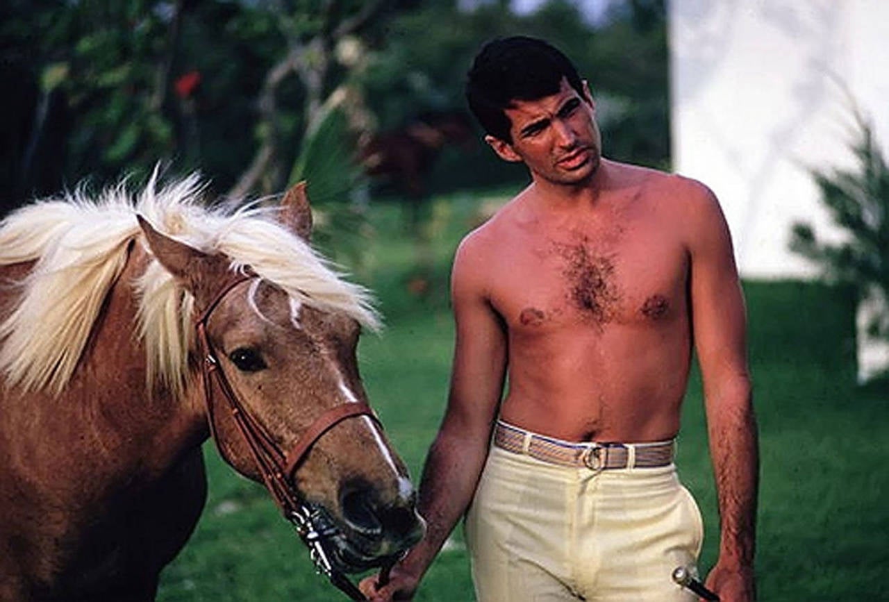 Slim Aarons 'George Hamilton with Horse on Capri' (Slim Aarons Estate Edition)