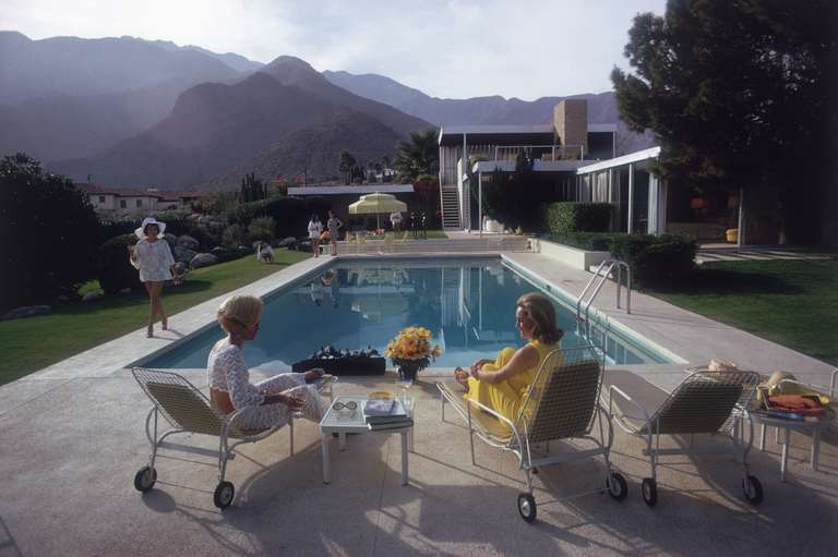 Slim Aarons Figurative Photograph - Poolside Gossip