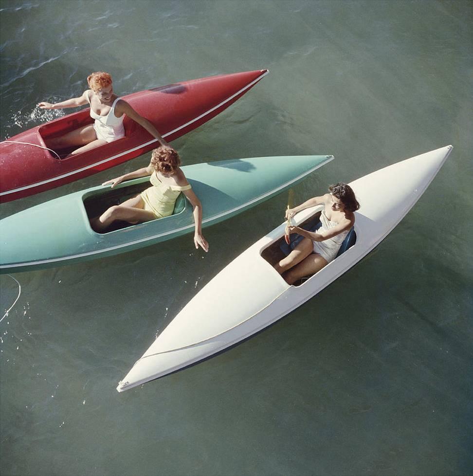 Young women canoeing on the Nevada side of Lake Tahoe, 1959. 

40 x 40 inches
$3950

30 x 30 inches
$3350

20 x 20 inches
$3000

This is a vibrant photograph, printed by the Slim Aarons estate.  It is part of the estate's only official limited run,