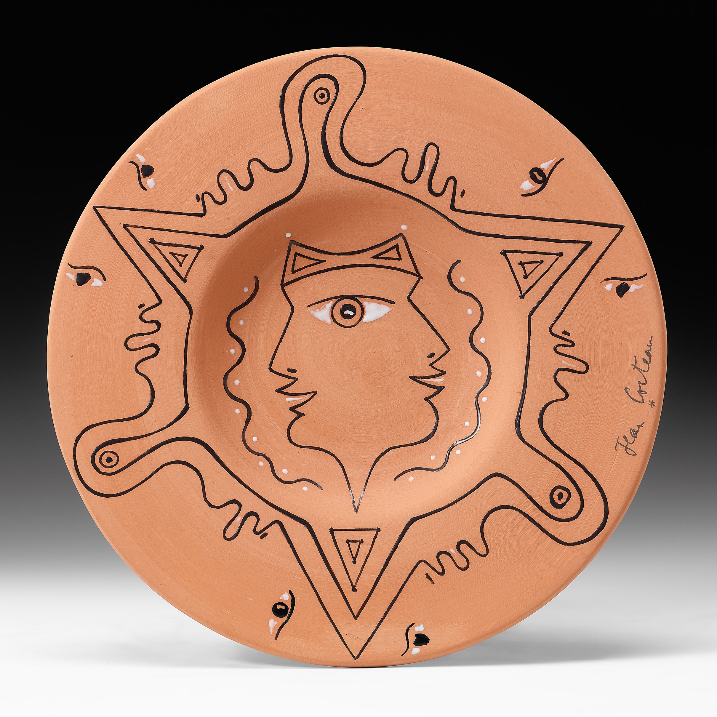 Jean Cocteau (1889 - 1963 )
" Hommage aux Etrusques " 
signed Jean Cocteau .
marked and numbered 20/20 .
Edition originale de Jean Cocteau.
Atelier Madeline - Jolly (underneath ).
Partially glazed Terracotta plate conceived in an edition of 20