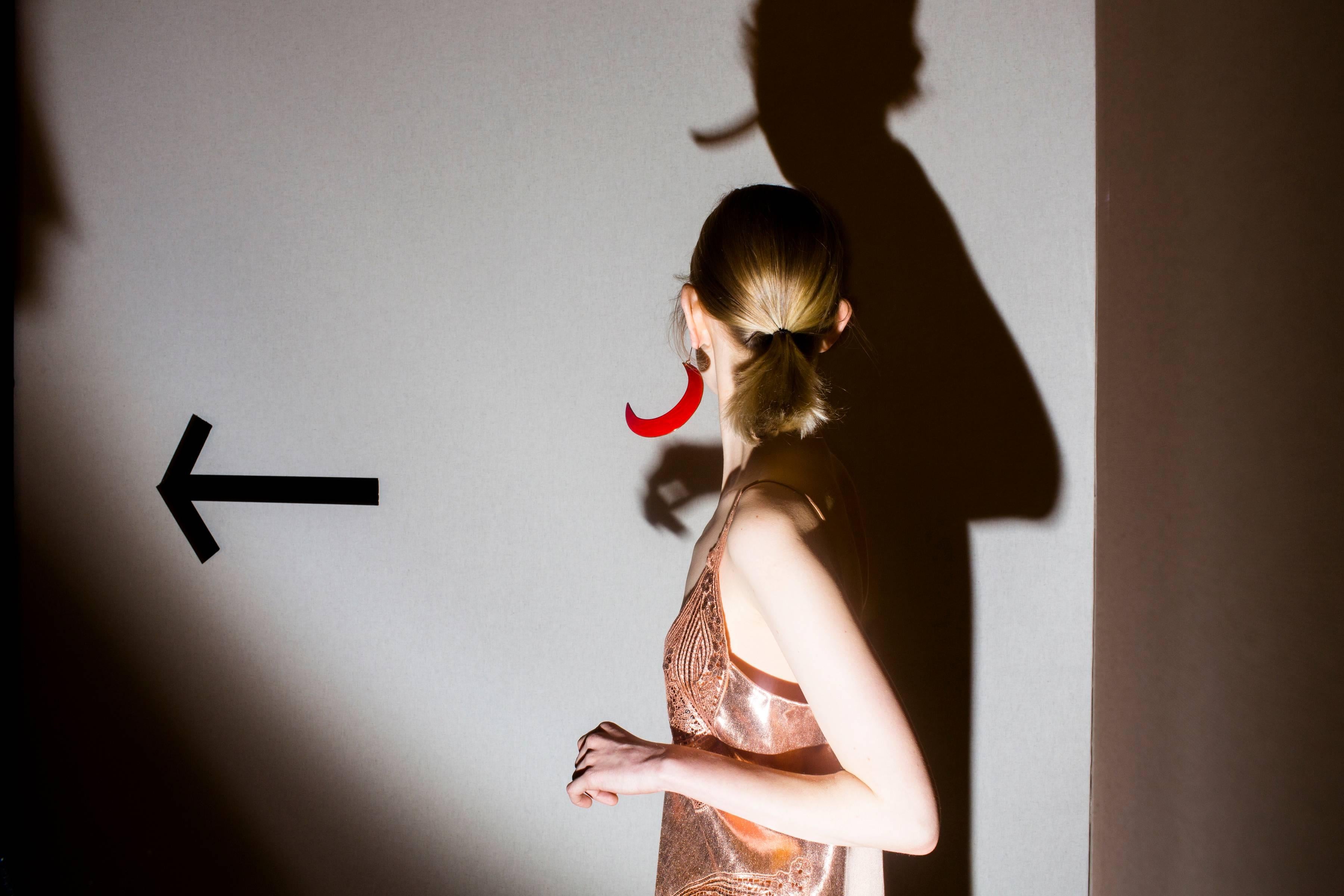 Landon Nordeman Figurative Photograph - "Stella McCartney (Red Earring with Arrow)" - Fashion Photography - Winogrand