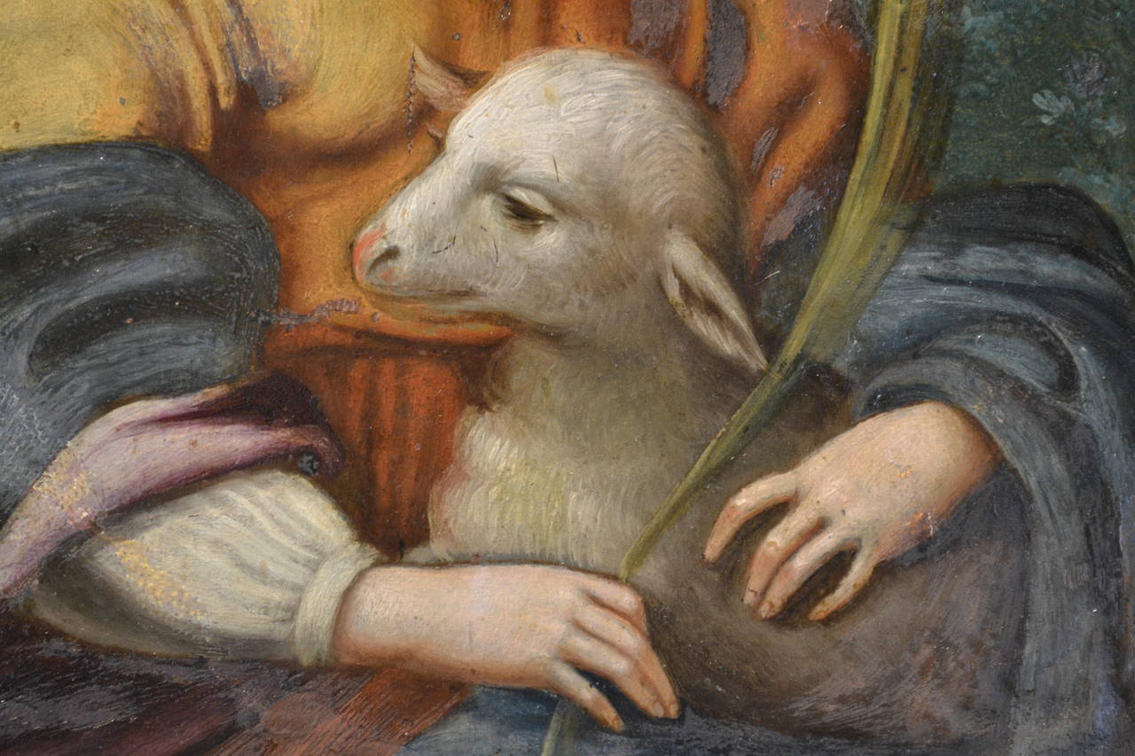 saint depicted with a lamb