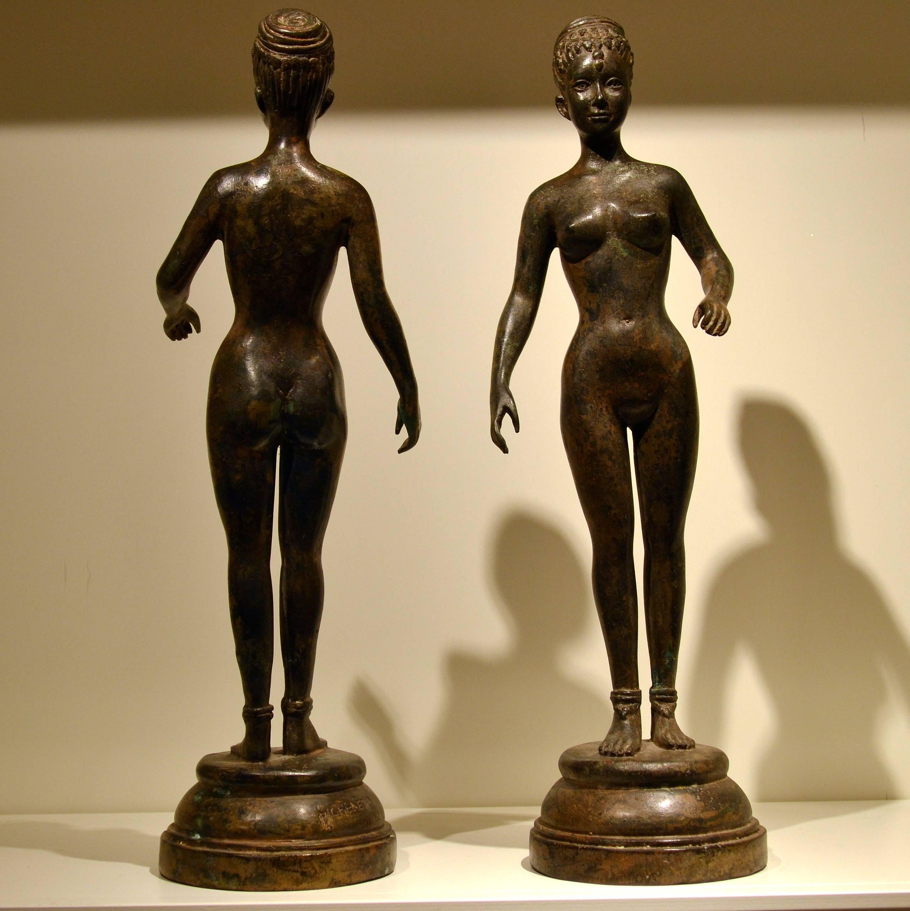 Pierre Chenet was a celebrated Art Deco sculptor in Paris during the early twentieth century.  This pair of Art Deco bronze nude female statues is characteristic of Chenet’s exploration of contemporary Western figures combined with primitive