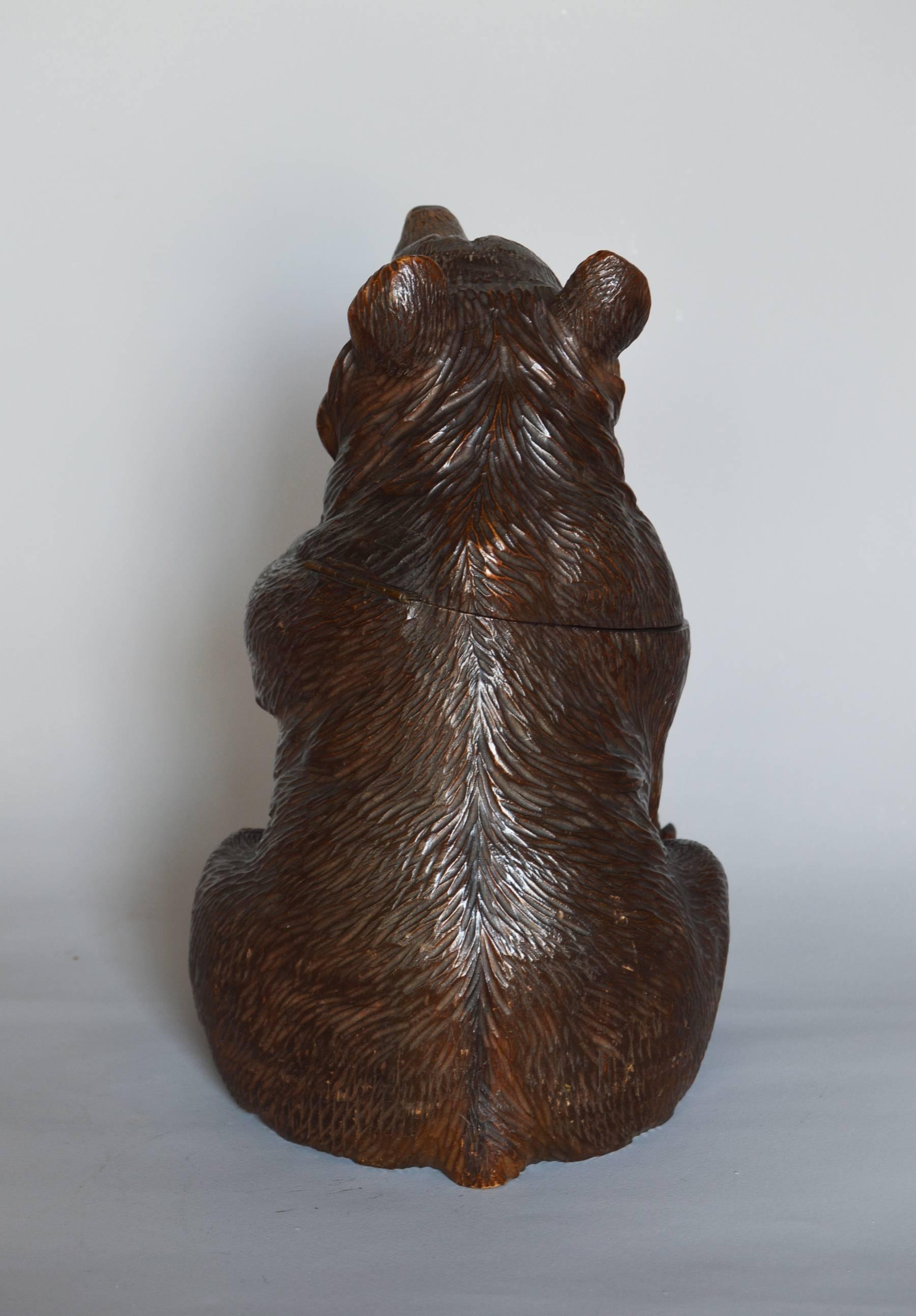 Swiss Black Forest Carved Bear Tobacco Jar
Height: 9½ inches
Width: 6 inches
Depth: 6½ inches
A late 19th century Swiss carved wooden bear as a tobacco jar. With original inset glass eyes and retaining the original painted decoration to the nose