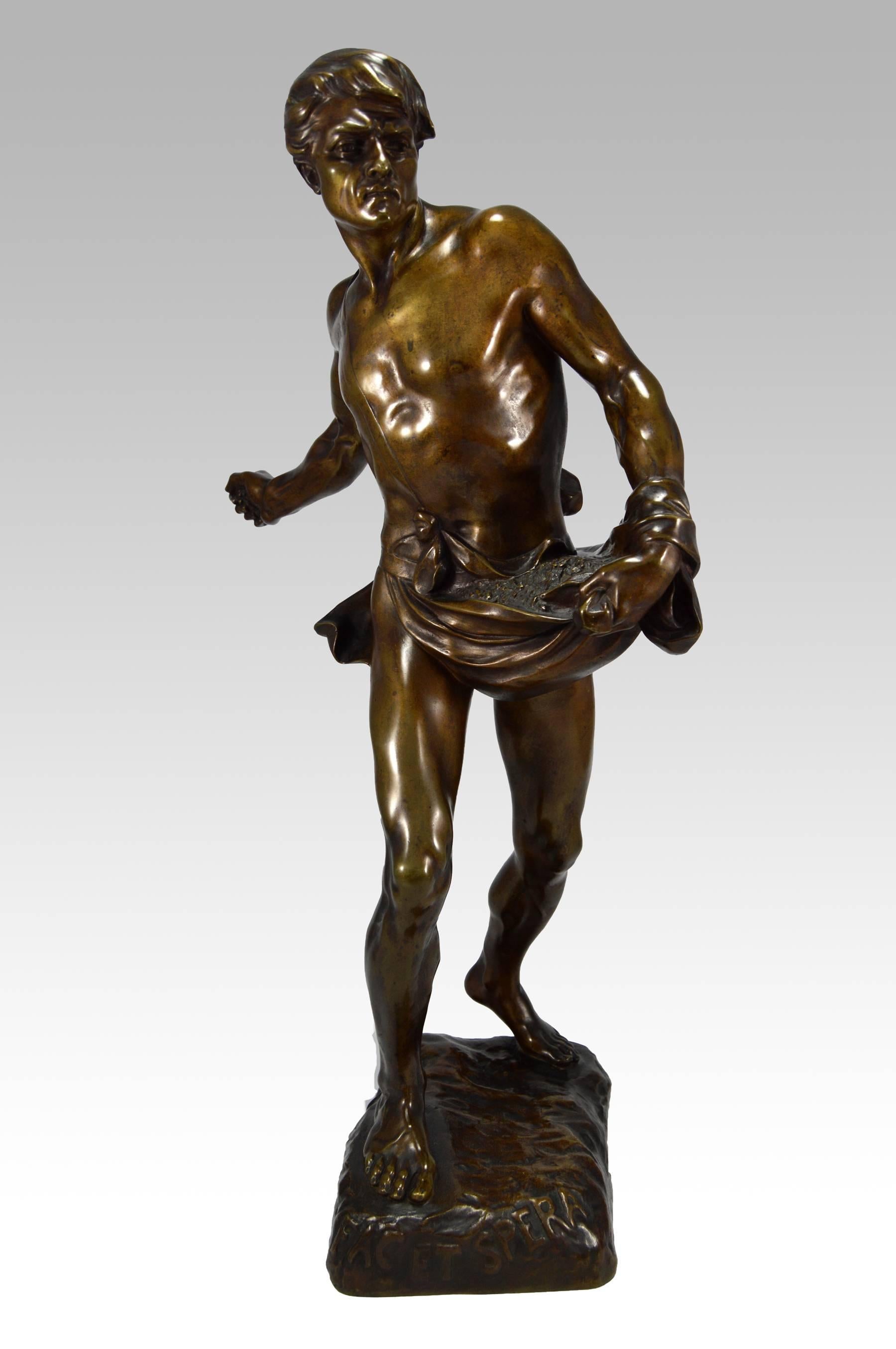 Sculpture française en bronze du 19ème siècle représentant un homme puisant des graines