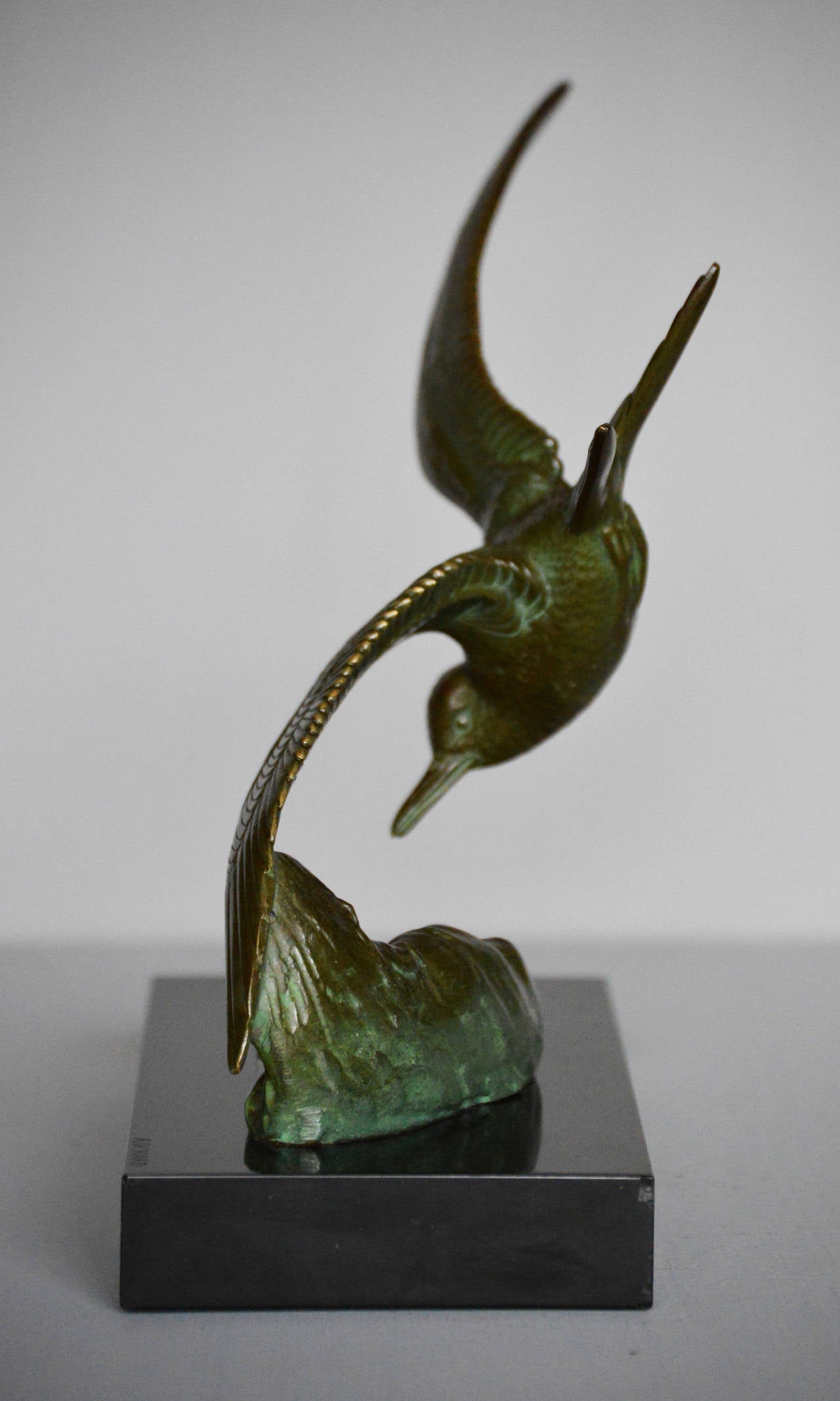 Irenee Rochard
French, (1906-1984)
Signed
Height: 8¾ inches
Width: 8 inches
Depth: 4 inches

A beautiful Art Deco bronze sculpture of a tern in flight above waves. The whole is raised on a black marble plinth and is signed to the bronze ‘I