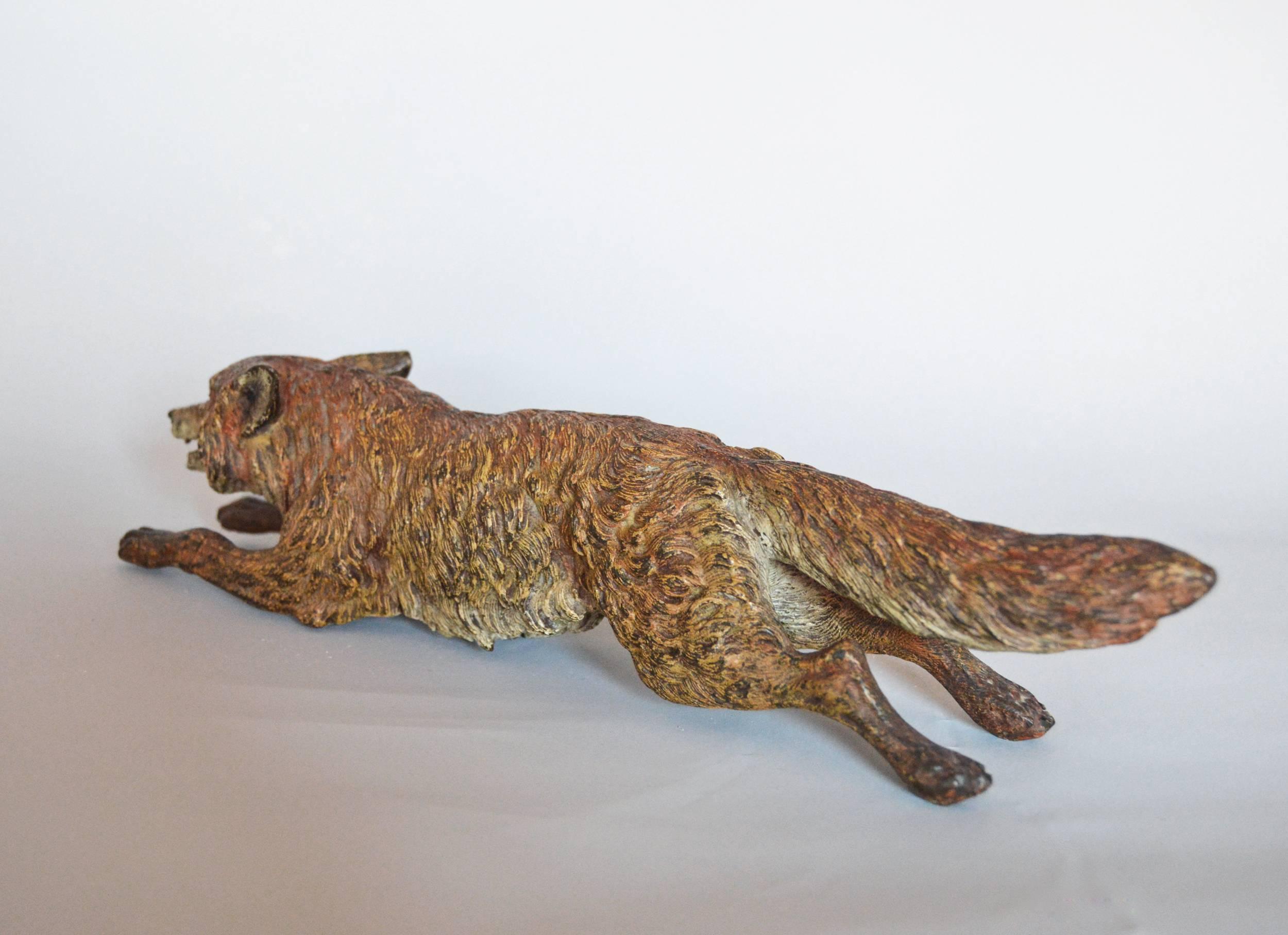 Cold Painted Sculpture of a Fox
Austrian, (C1900)
Bronze, stamped ‘GESCHUTZT’
Height: 2¾ inches 
Width: 11½ inches
Depth: 2¼ inches

A charming Viennese bronze study of a Fox in the manner of by Franz Bergman with lovely hand finished detail