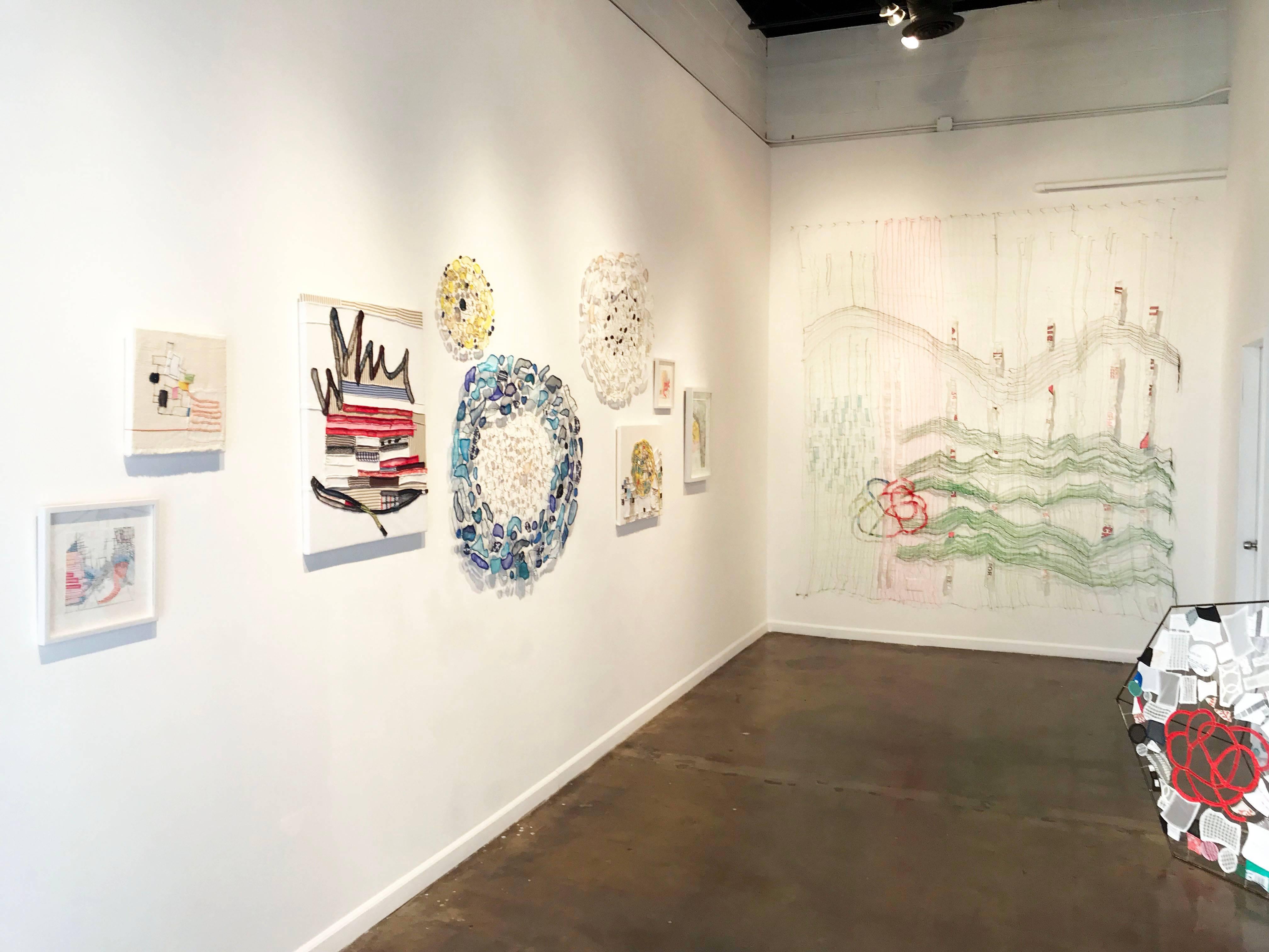 Untitled, 2016, 29 x 34”, suspended fabric, plastic, netting, pipe cleaners, thread, wire, fishing weights, $1,100.

Caroline Lathan-Stiefel’s delicately-webbed “drawings-in-space” cover, divide, encircle, and fill
spaces. Often large in scale, they