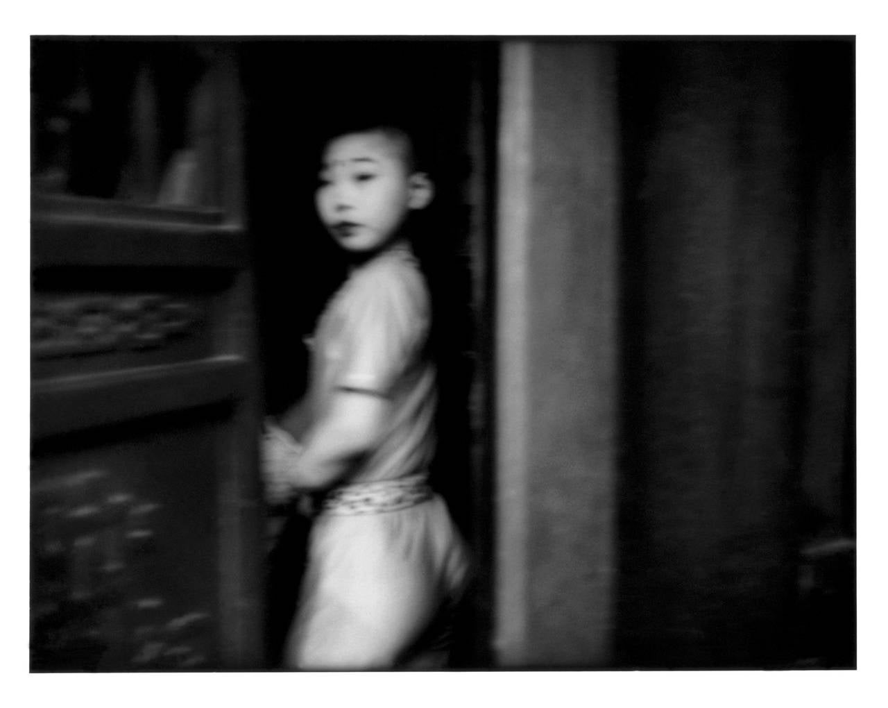 Suspicious glance from a young theatrical performer, Beijing, China
