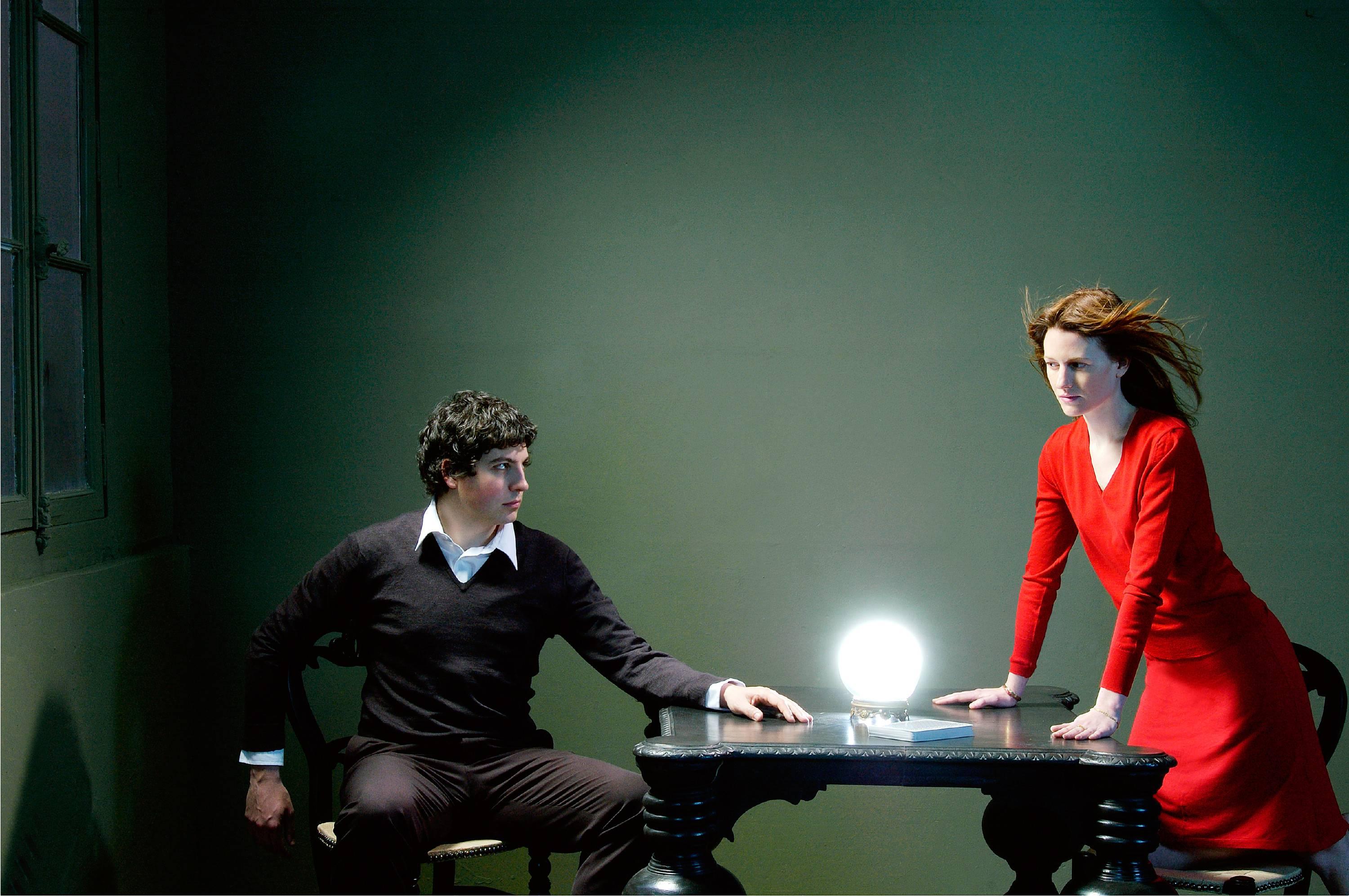 Sophie Delaporte Color Photograph - a couple with a woman with a red dress, mystery