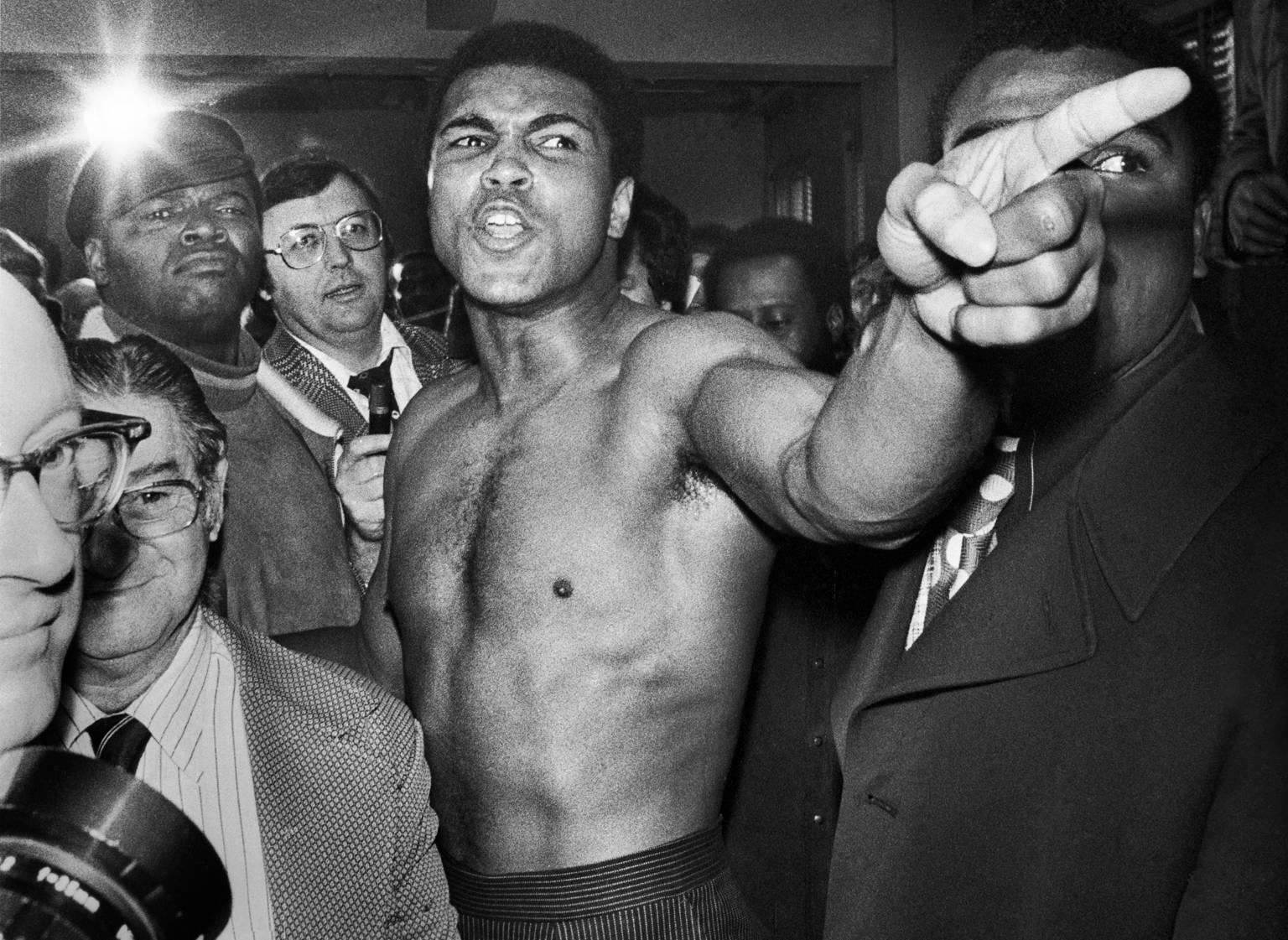 Jean-Pierre Laffont Black and White Photograph - Muhammad Ali menacing Joe Frazier before rematch, Madison Square Garden, NY, Jan