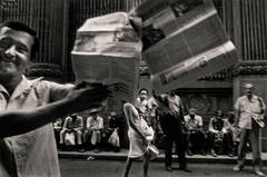 Vintage Man selling Granma newspaper, Havana