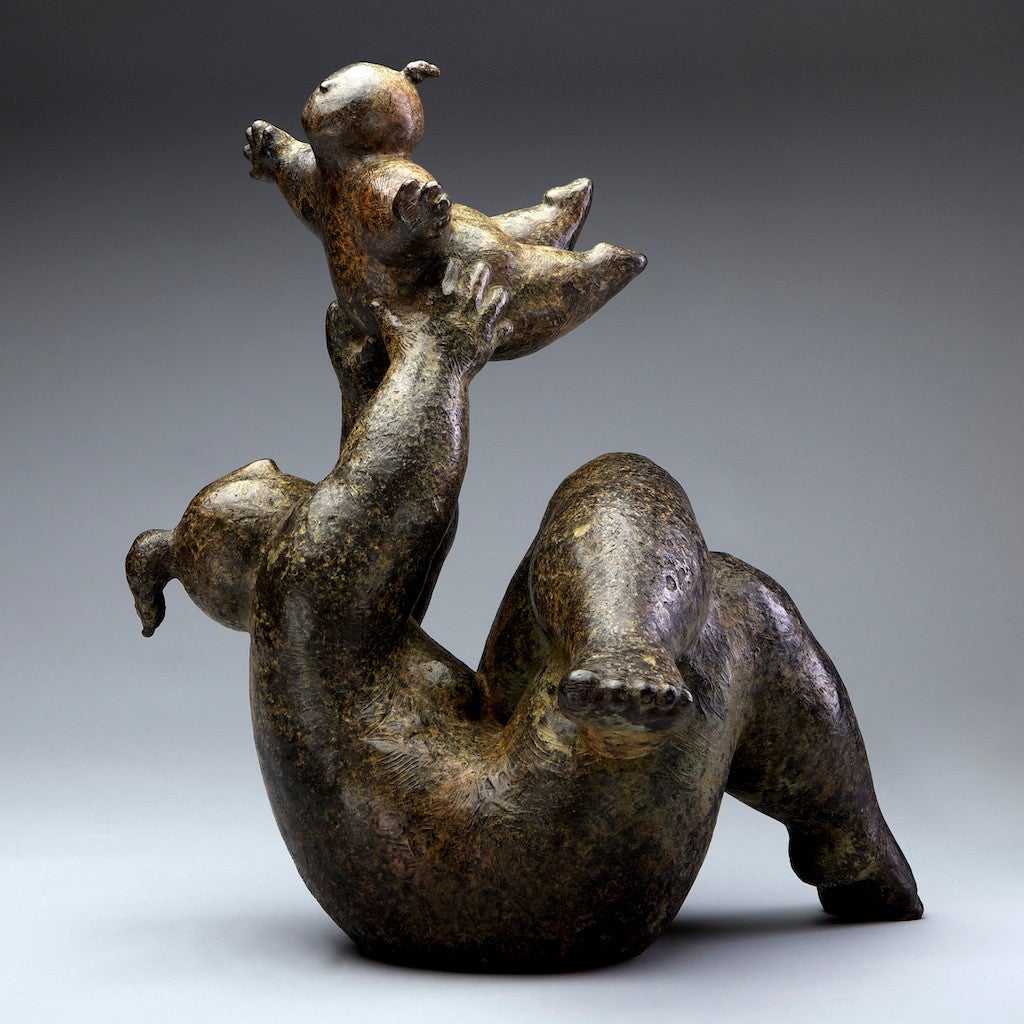 "Learning to Fly" Bronze sculpture of a voluptuous woman holding a child up