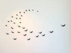"On Dusk 27" bronze birds, black patina flock in formation across sky