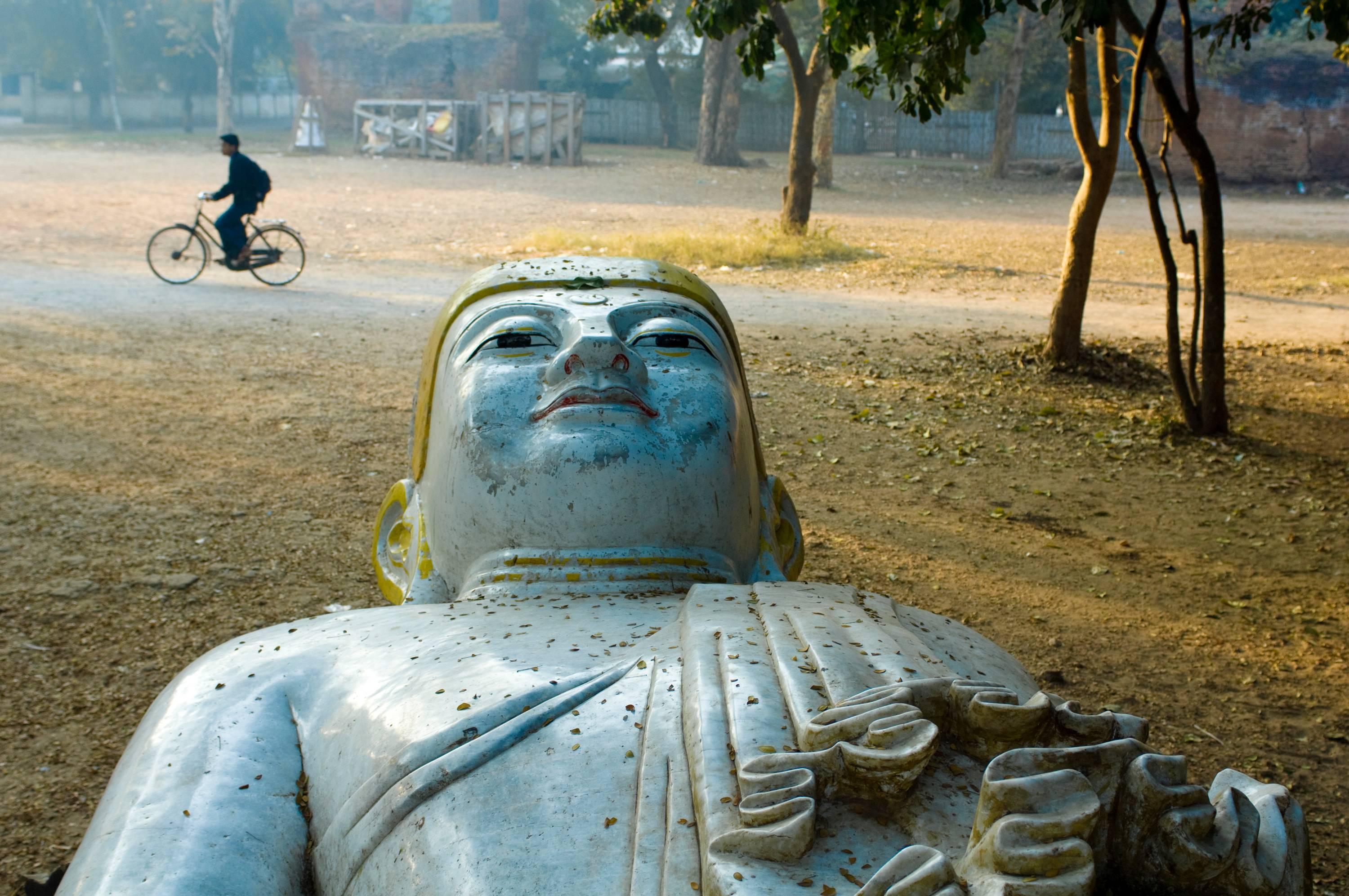 Steve McCurry Color Photograph - Buddha and Bicycle, Mandalay, Burma