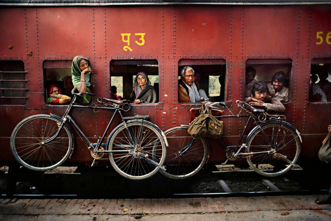 Bicycles on Side of Train - Photograph by Steve McCurry