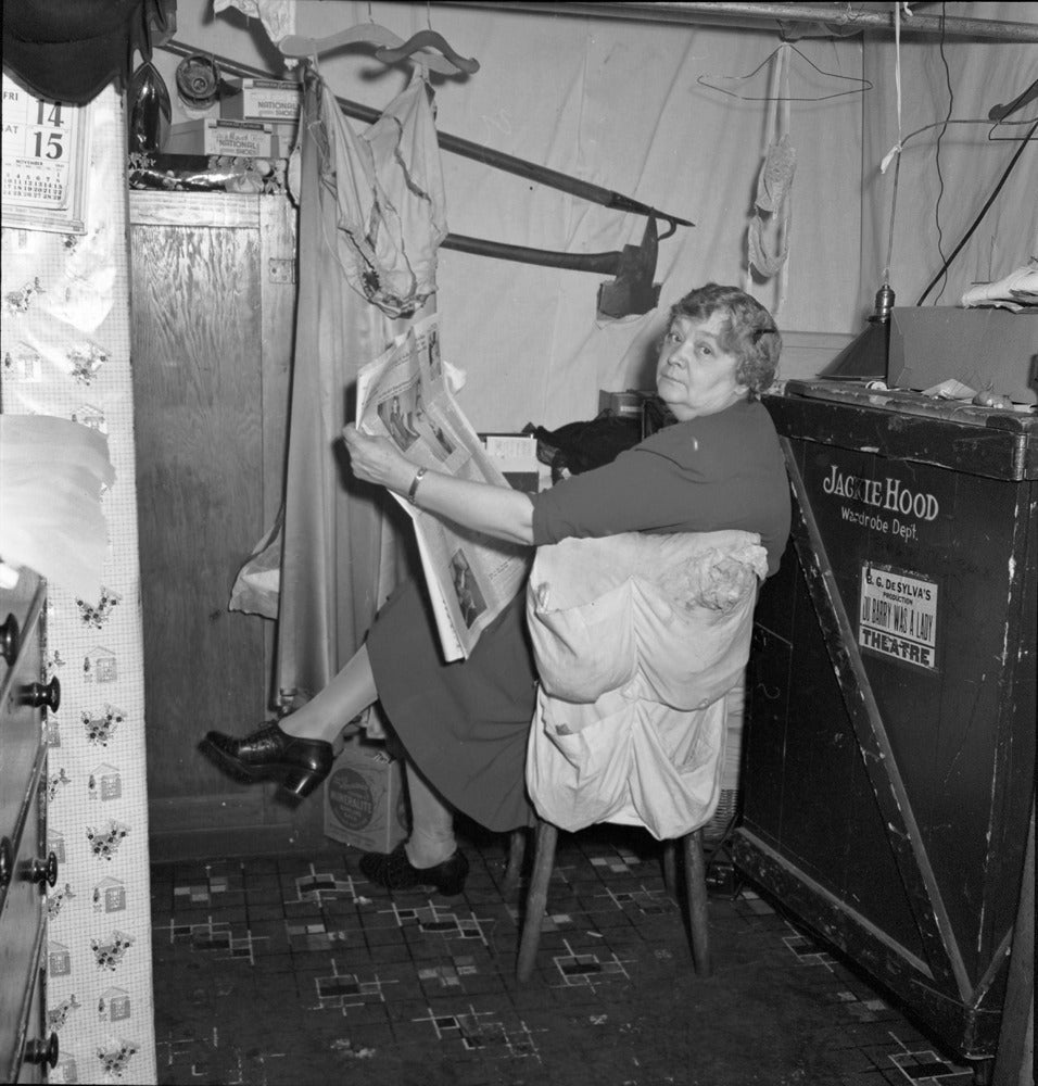 George Mann Black and White Photograph - Backstage with the Wardrobe Mistress