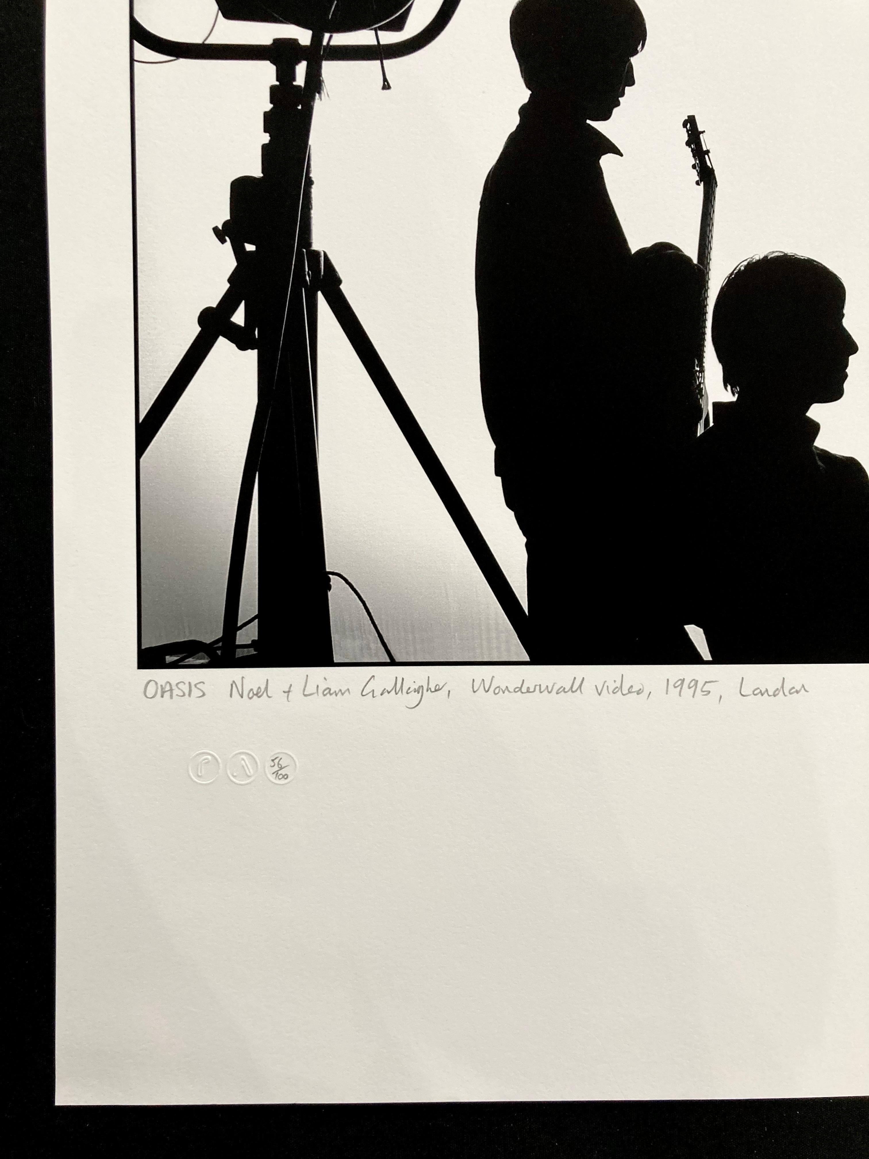 Signed limited edition print. Silhouette portrait of Liam and Noel Gallagher of Oasis taken by celebrated rock photographer, Jill Furmanovsky during a break in the making of the Wonderwall video.  Signed limited edition photo.

Location: