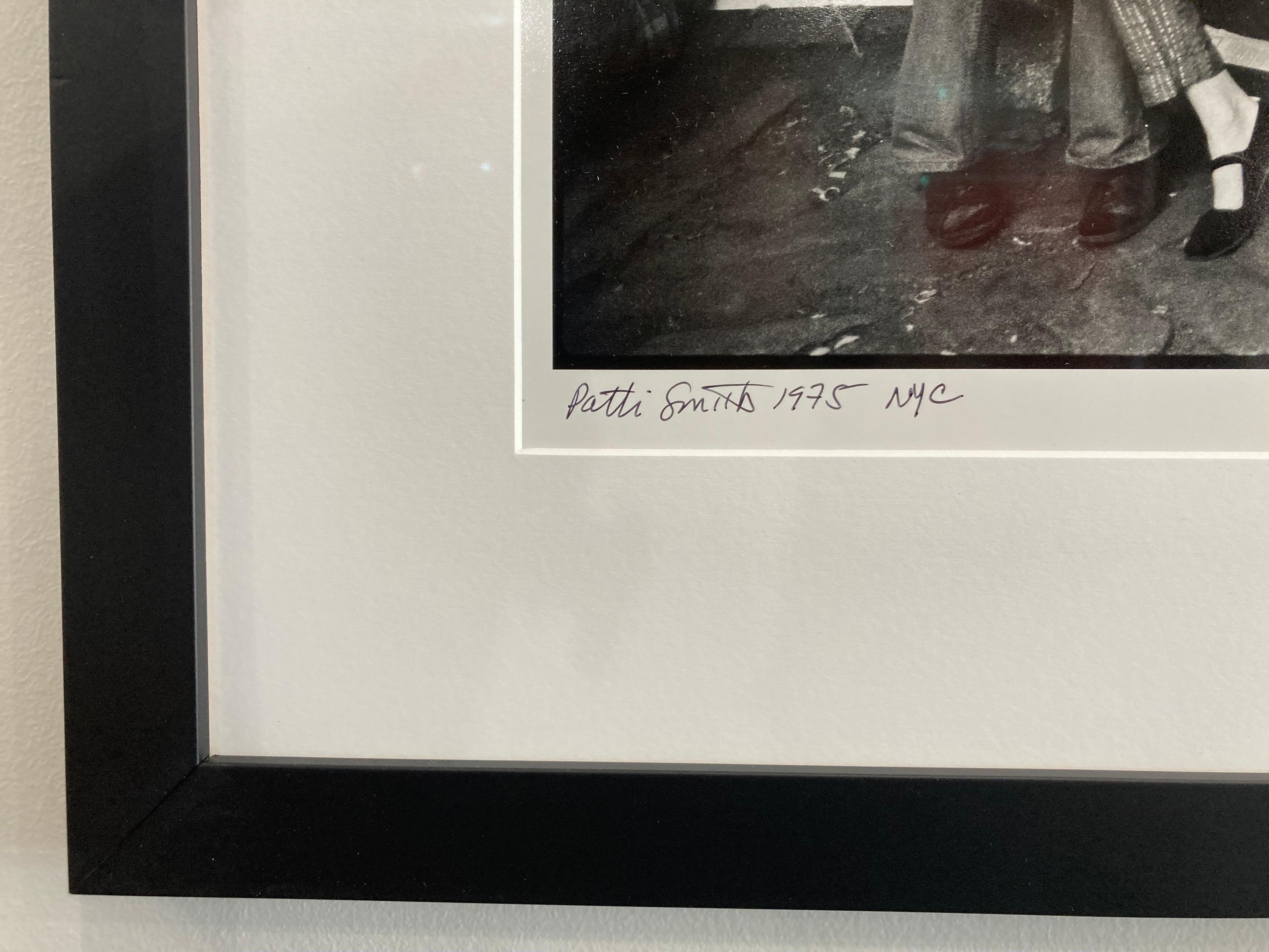 Patti Smith taken in NYC during a 1975 Iran War protest by Lynn Goldsmith.

Recently framed with non-glare museum glass, signed limited edition 16x20