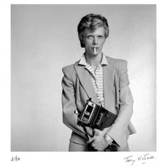 David Bowie holds a cassette player, 1974 by Terry O’Neill