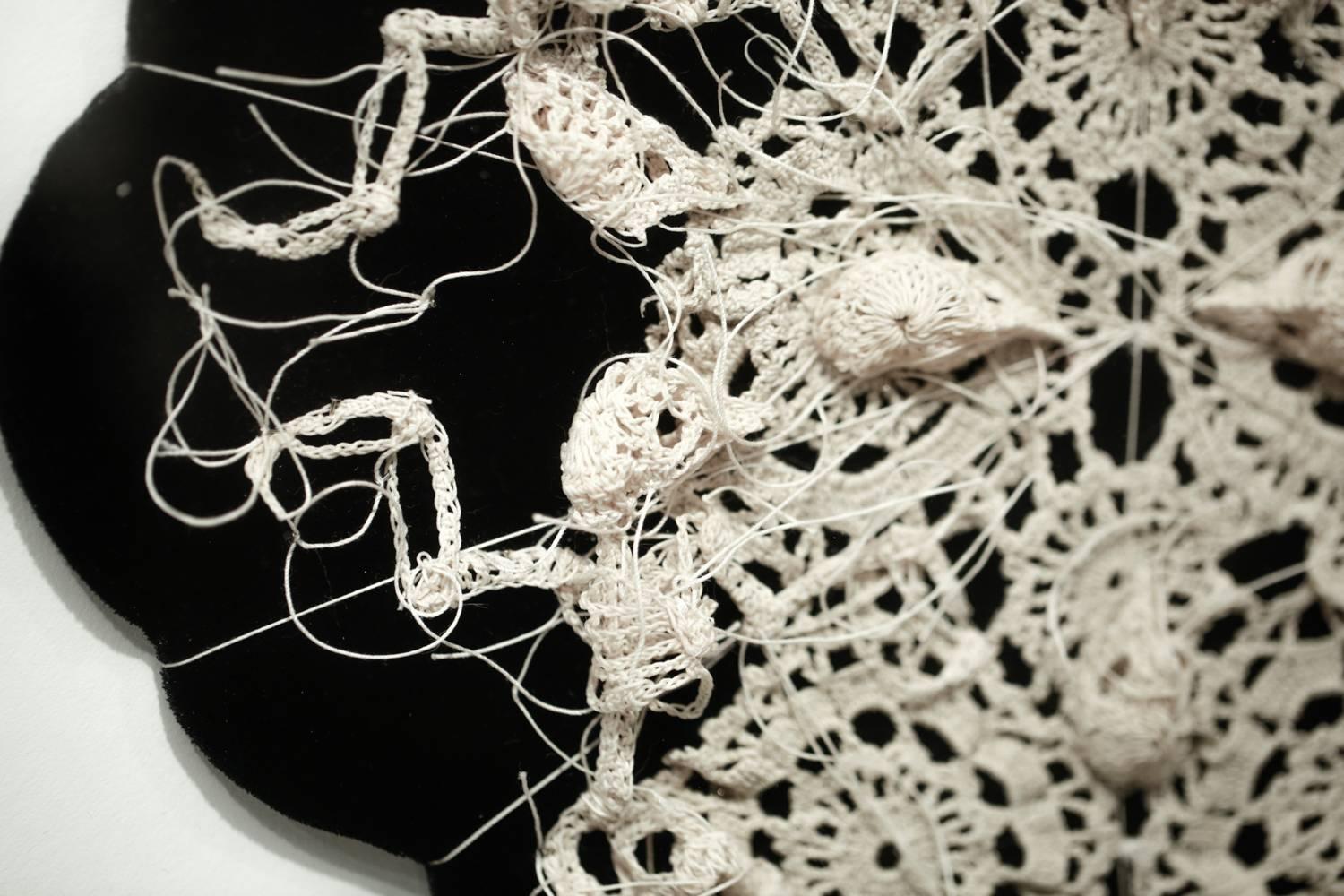 "Withermore" is an original crocheted sculptural work by Caitlin McCormack made of stiffened cotton string, antique remnant, steel pins, and velvet. The piece ships in the pictured white frame and measures 27.25”h x 27.25”w x 2.5”d.

Bio