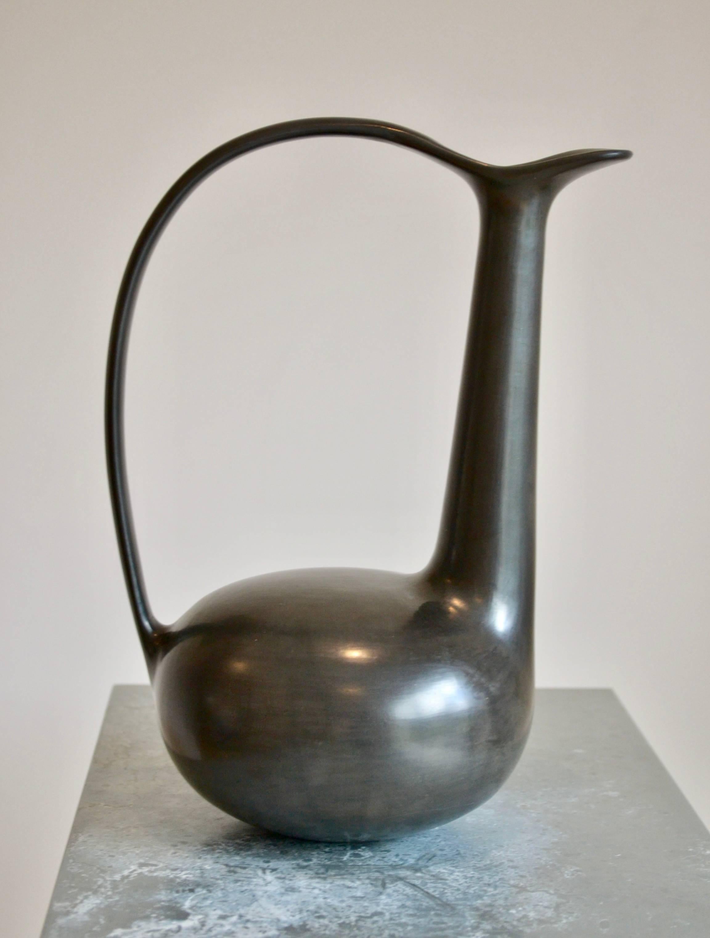 Bucchero Vase designed  by Gio Ponti and by the great Italian Artisan Carlo Alberto Rossi of the 40's.

The bucchero is a special clay, from the Etruscan times, was dried in open air and ,after baked in oven at very high temperature, which removes